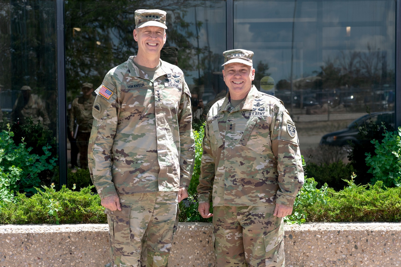 two military members posing for a photo smiling