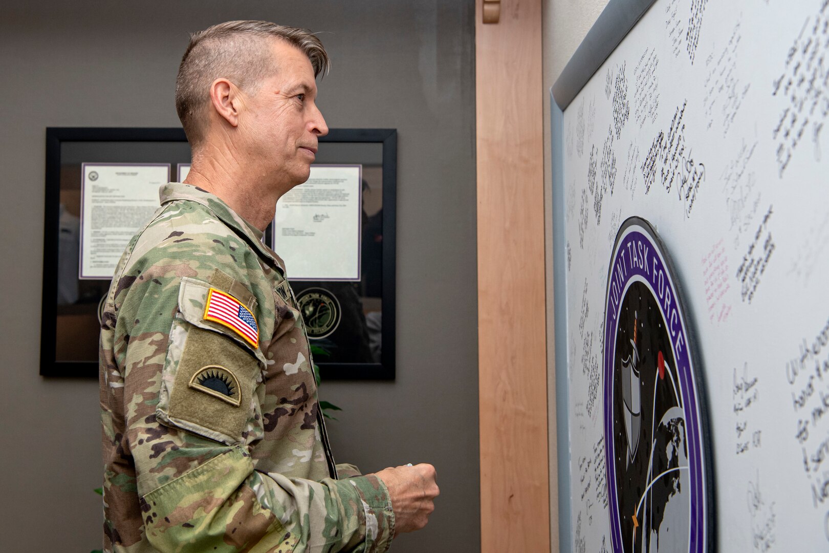 military member looking at board