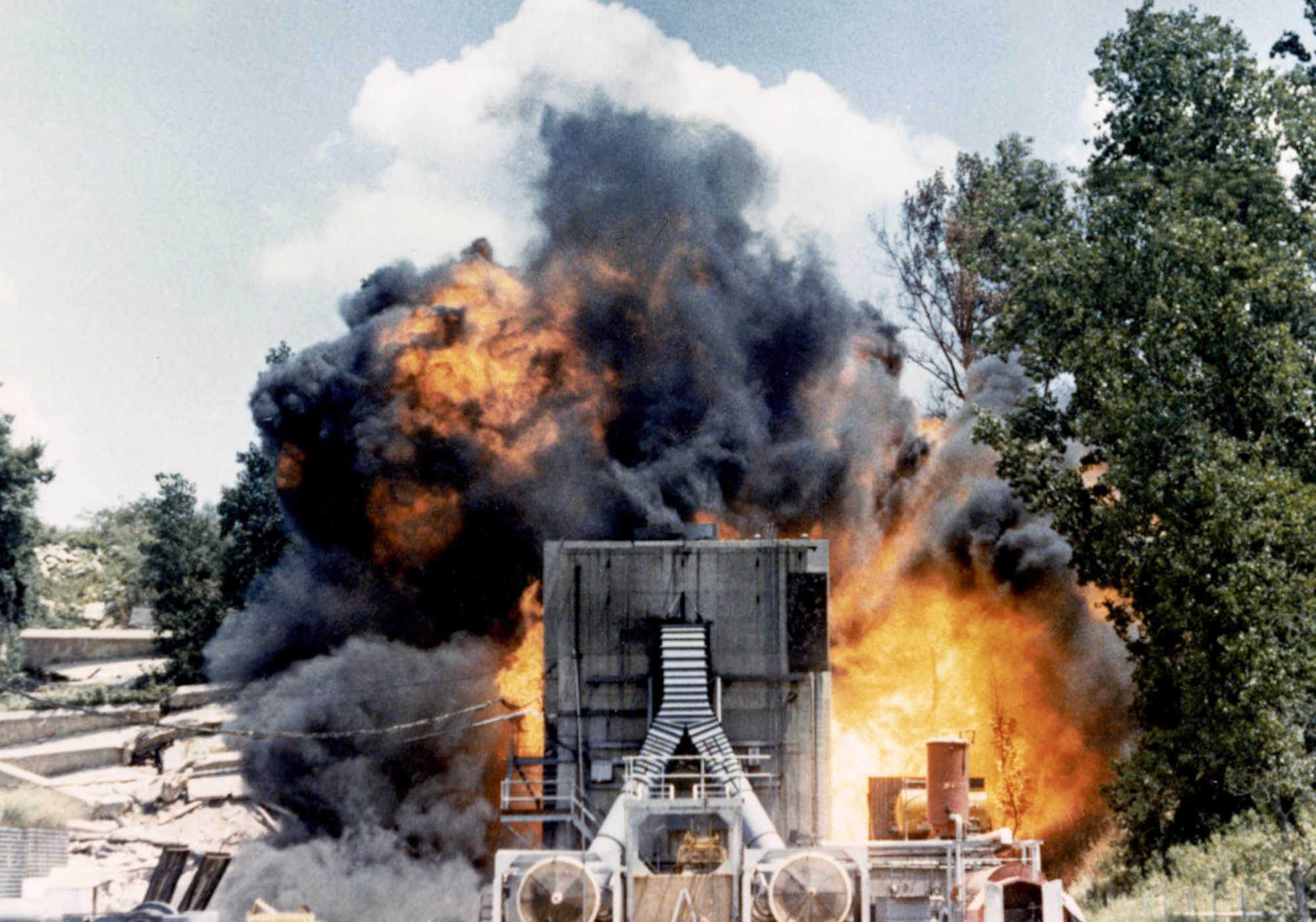 This historic photo shows the result of a ballistic impact on an aircraft fuel tank at the Aerospace Vehicle Survivability Facility (AVSF). The AVSF is responsible for developing and executing aircraft live fire test and evaluation programs as well as research, development, test and evaluation in addition to high-fidelity modeling and simulation of aerospace vehicle combat survivability to evaluate and enhance system performance to current and future weapon systems under operationally-realistic conditions. The AVSF is operated by the Aerospace Survivability and Safety Office at Wright-Patterson Air Force Base, Ohio. This office is part of the 704th Test Group at Holloman Air Force Base, New Mexico. The 704 TG is a unit of the Arnold Engineering Development Complex headquartered at Arnold Air Force Base, Tennessee. (Courtesy photo)