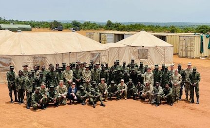 Members of the Nebraska Air National Guard and Rwanda Defence Force pose for a group picture March 20, 2022, during the Justified Accord exercise at Gako Military Academy, Rwanda. The Nebraska Guard and Rwanda are partners under the Department of Defense National Guard Bureau State Partnership Program.