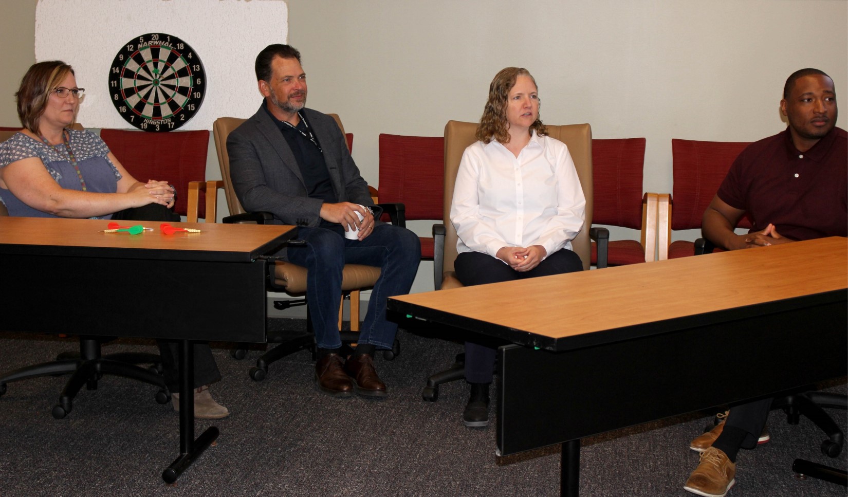 Air Force Research Laboratory Digital War Room members, from left, Andrea Mahaffey, Dr. James Sumpter and Dr. Pamela Kobryn, discuss the release of the Digital Accelerator for Research Transformation effort, DART 1.0, with “Digital Dialogue” webinar series moderator Juston Hugue, far right, at Wright-Patterson Air Force Base, Ohio, June 30, 2022. DART is an online library with new products, capabilities and solutions offered to the workforce on a quarterly basis in support of the lab’s digital transformation efforts. (U.S. Air Force photo / Kati Cospy)