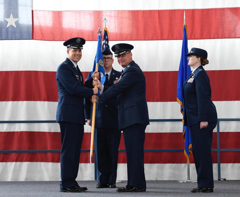 Col. Seth Spanier, the 28th Bomb Wing vice commander, relinquishes Col. Robert Corby, the 28th Medical Group outgoing commander, of his command of the 28th Medical Group at Ellsworth Air Force Base, S.D., July 06, 2022.