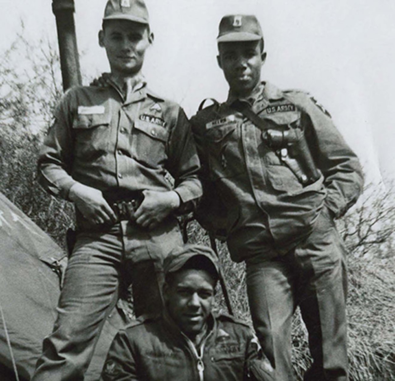 Three soldiers pose for a photo