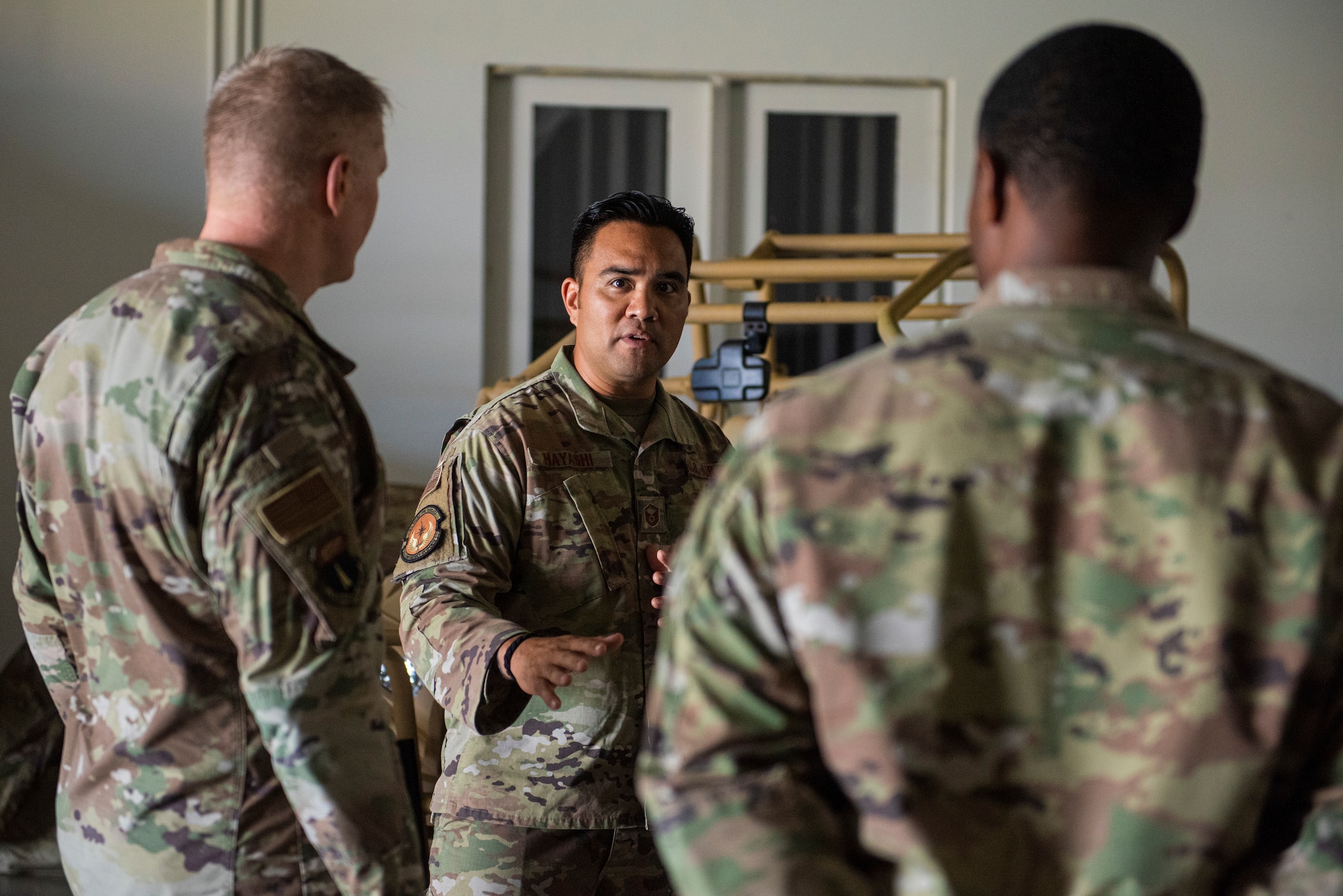 U.S. Air Force Brig. Gen. Paul Birch, 36th Wing commander, receives a brief about agile combat employment by Master Sgt. Gabriel Hayashi, 36th Contingency Response Squadron production superintendent, during an immersion tour at Andersen Air Force Base, Guam, June 23, 2022. Birch was briefed on CRS capabilities as well as radar capabilities and communication flyaway kits. (U.S. Air Force photo by Staff Sgt. Suzie Plotnikov)