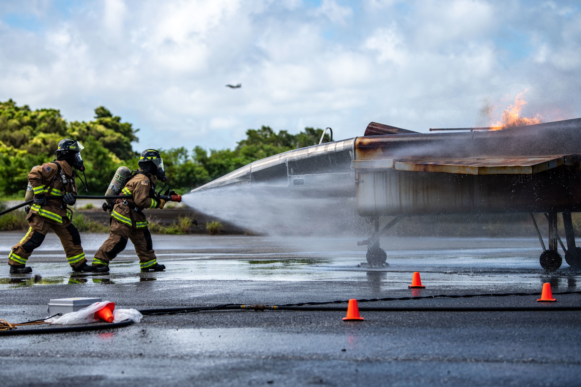 Firefighters extinguish a fire.