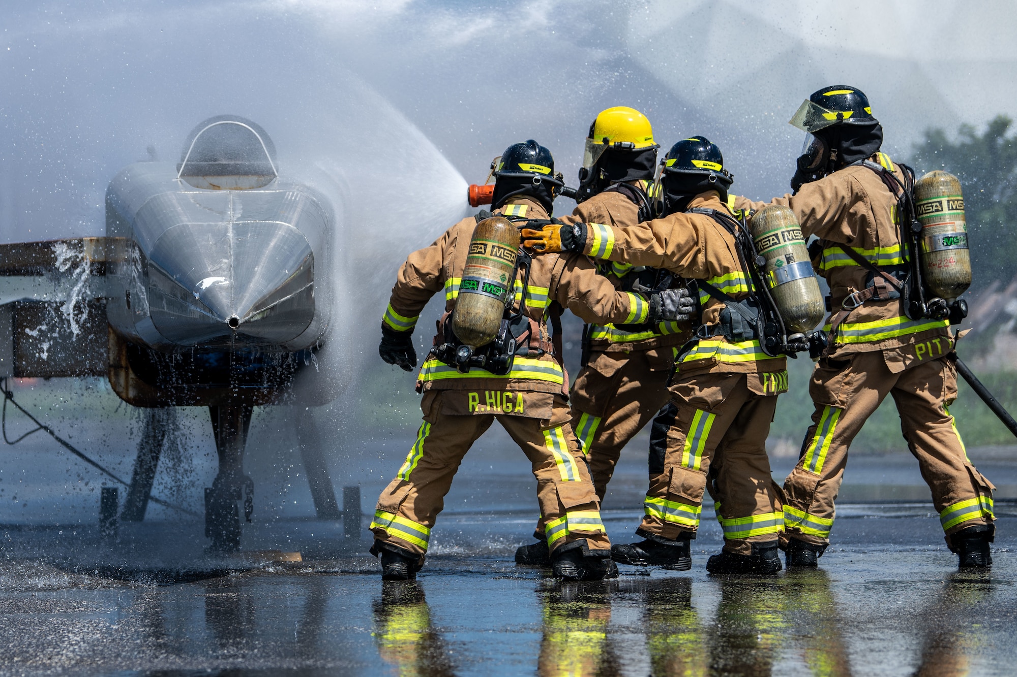 Firefighters extinguish a fire.