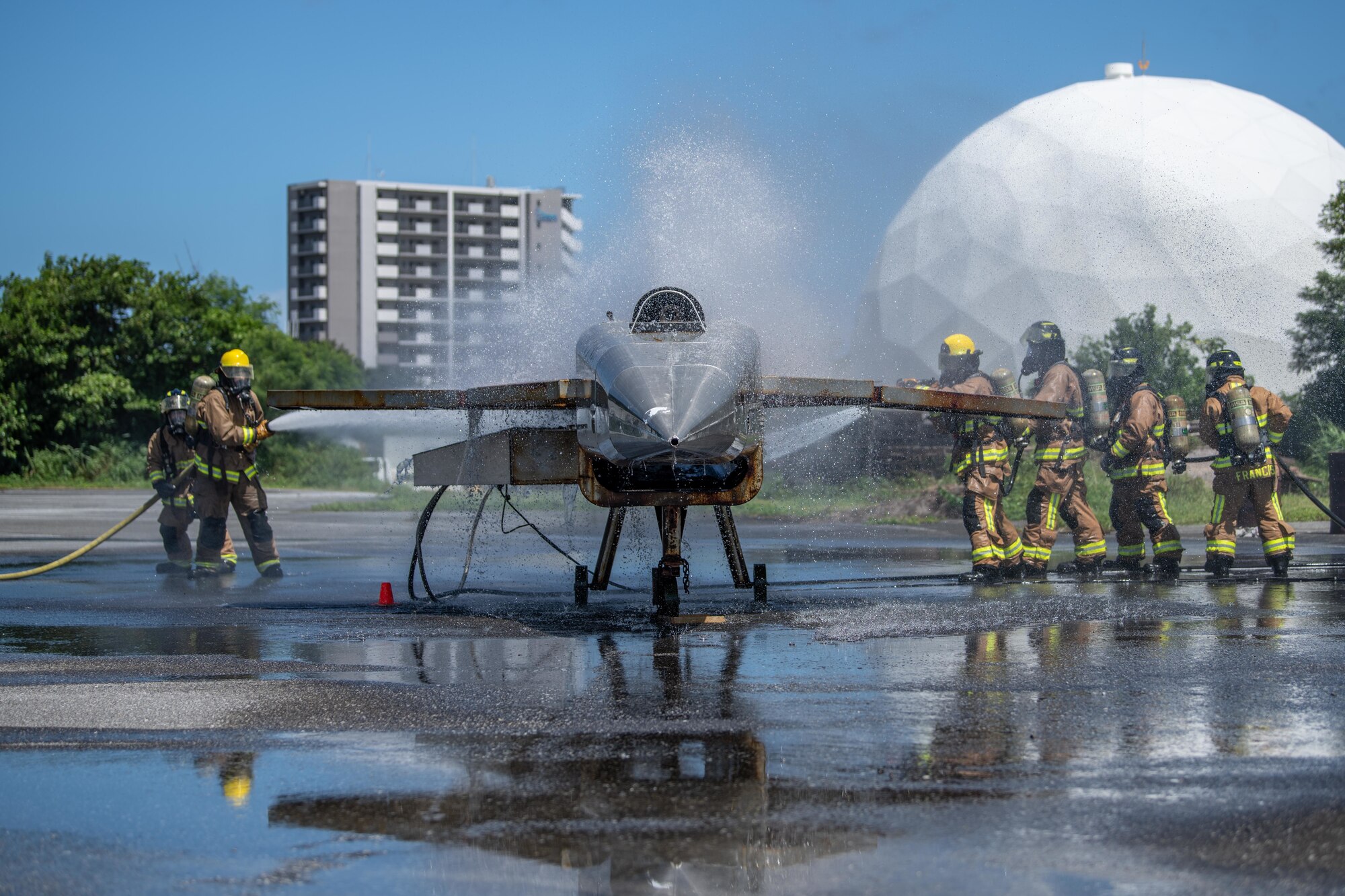 Firefighters extinguish a fire.