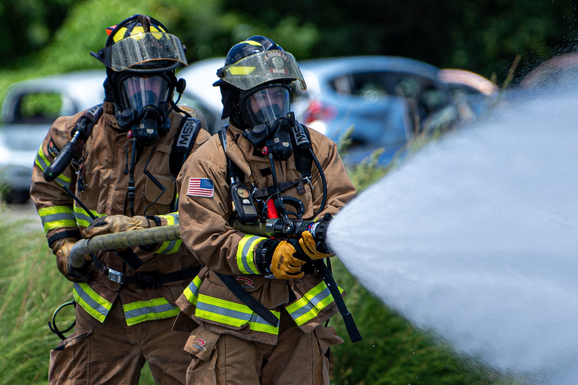 Firefighters extinguish a fire.