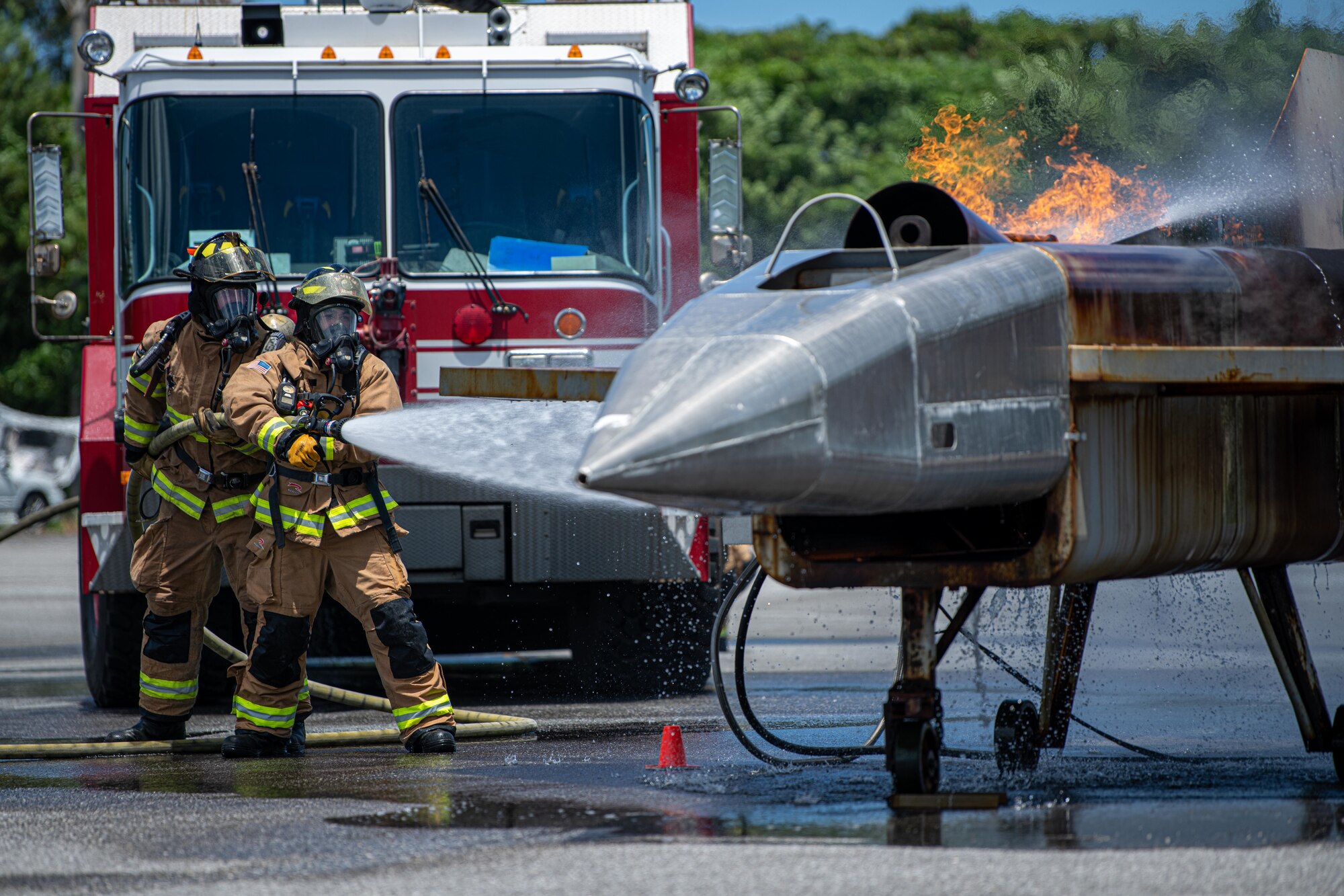 Firefighters extinguish a fire.