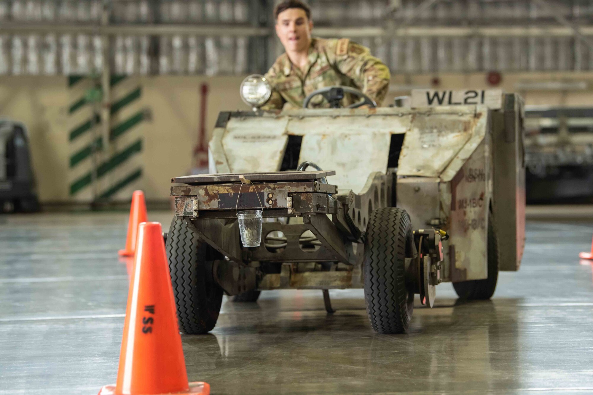 U.S. Air Force Staff Sgt. Todd Olson, 13th Aircraft Maintenance Unit weapons load team member, operates an MJ-1 standard lift truck through cones during the second quarter “Jammer” driver competition at Misawa Air Base, Japan, July 1, 2022.