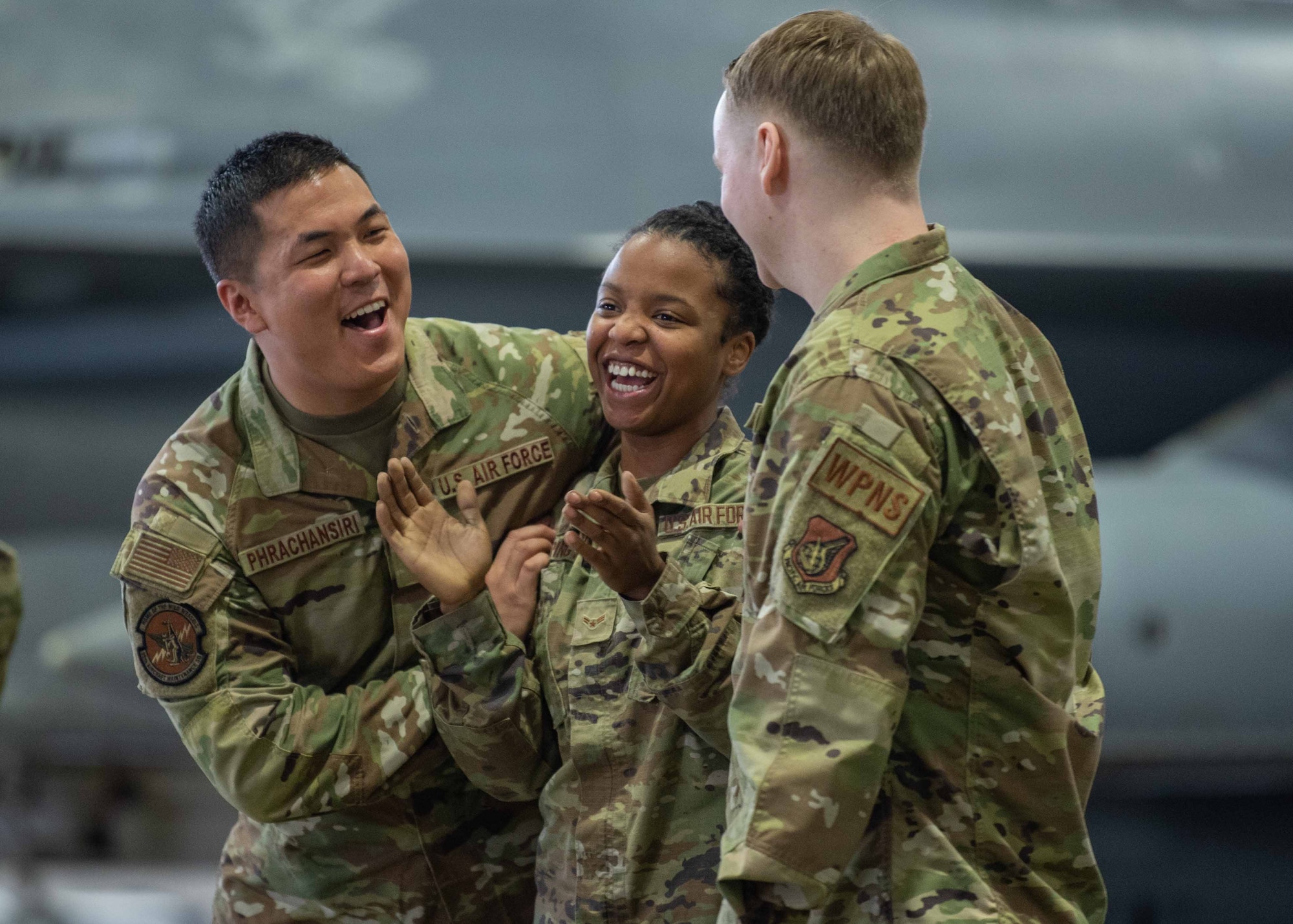 U.S. Air Force Airmen assigned to the 14th Aircraft Maintenance Unit (AMU) celebrate winning the second quarter load crew competition at Misawa Air Base, Japan, July 1, 2022.