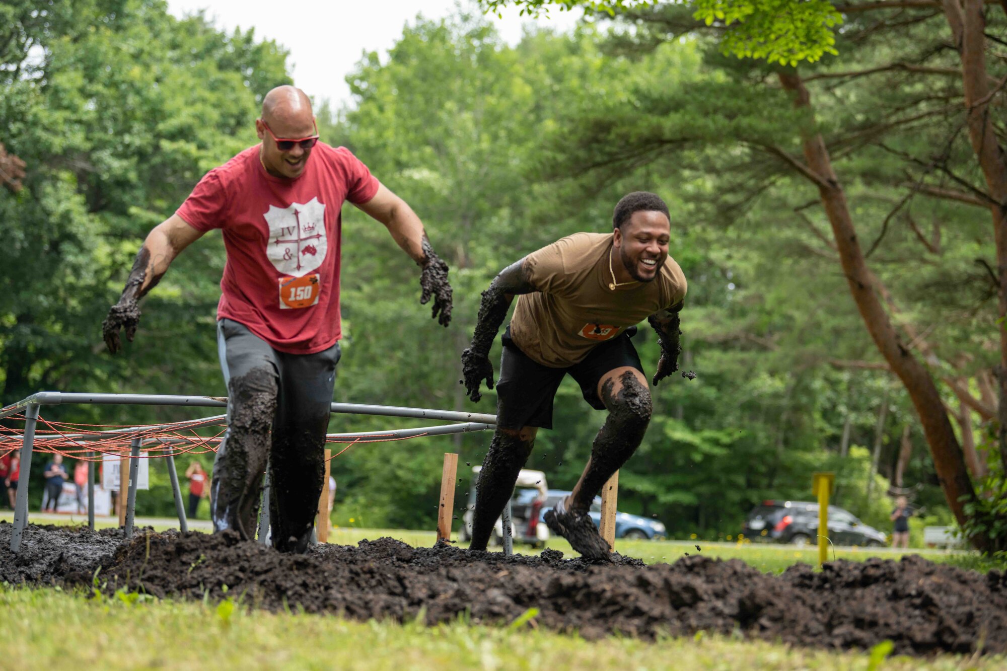 Participants walk through the mud during the annual Misawa Mudder at Misawa Air Base, Japan, July 2, 2022.