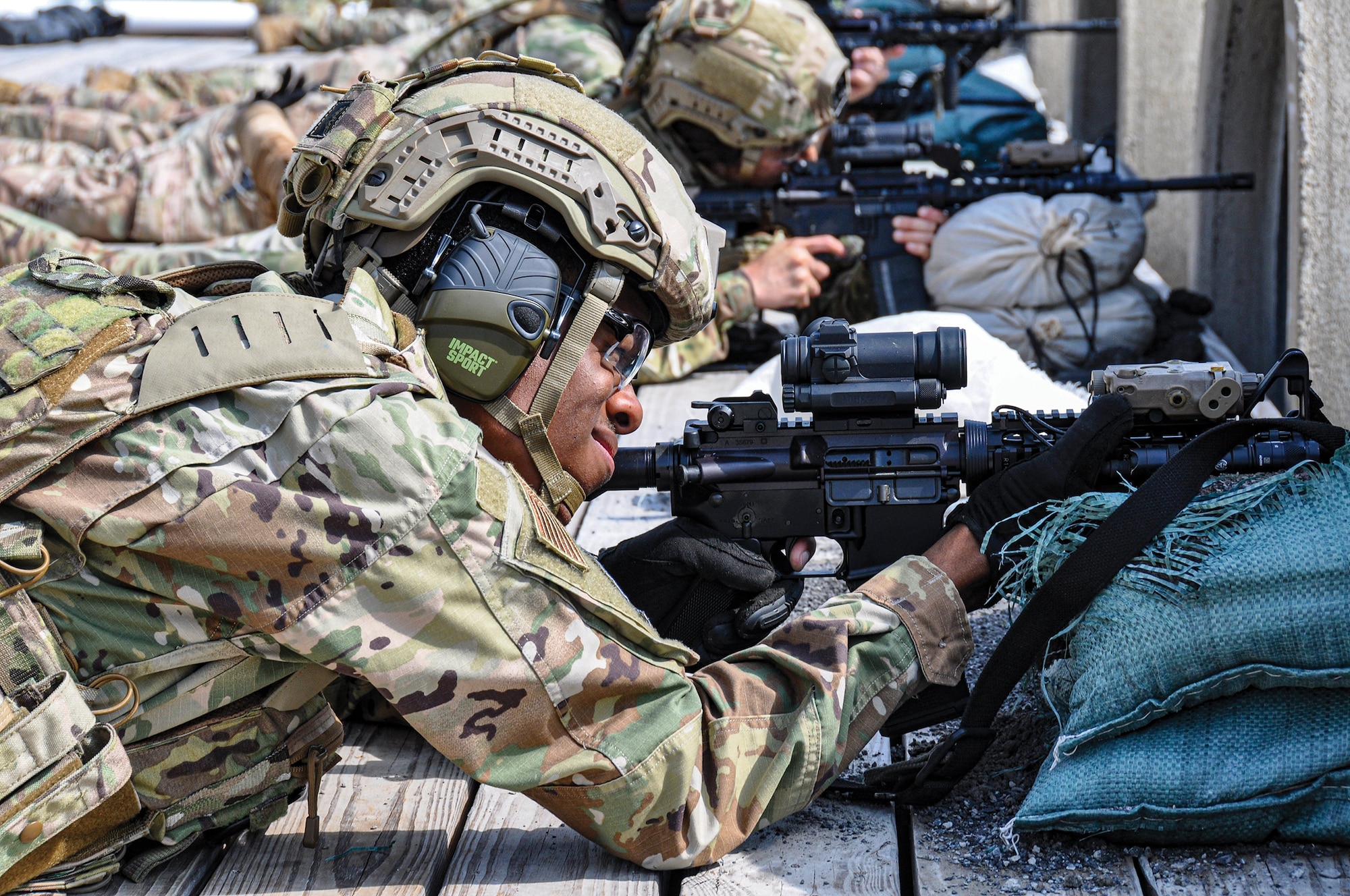 445th Security Forces Squadron Airmen fire their M4 carbine from a prone position on a range located in Camp Dawson Army Training Site, West Virginia, as part of the 445th Security Forces Squadron’s annual tour, June 6-10, 2022. Over the course of two days, 35 defenders from the squadron expended 26,000 rounds of ammunition.