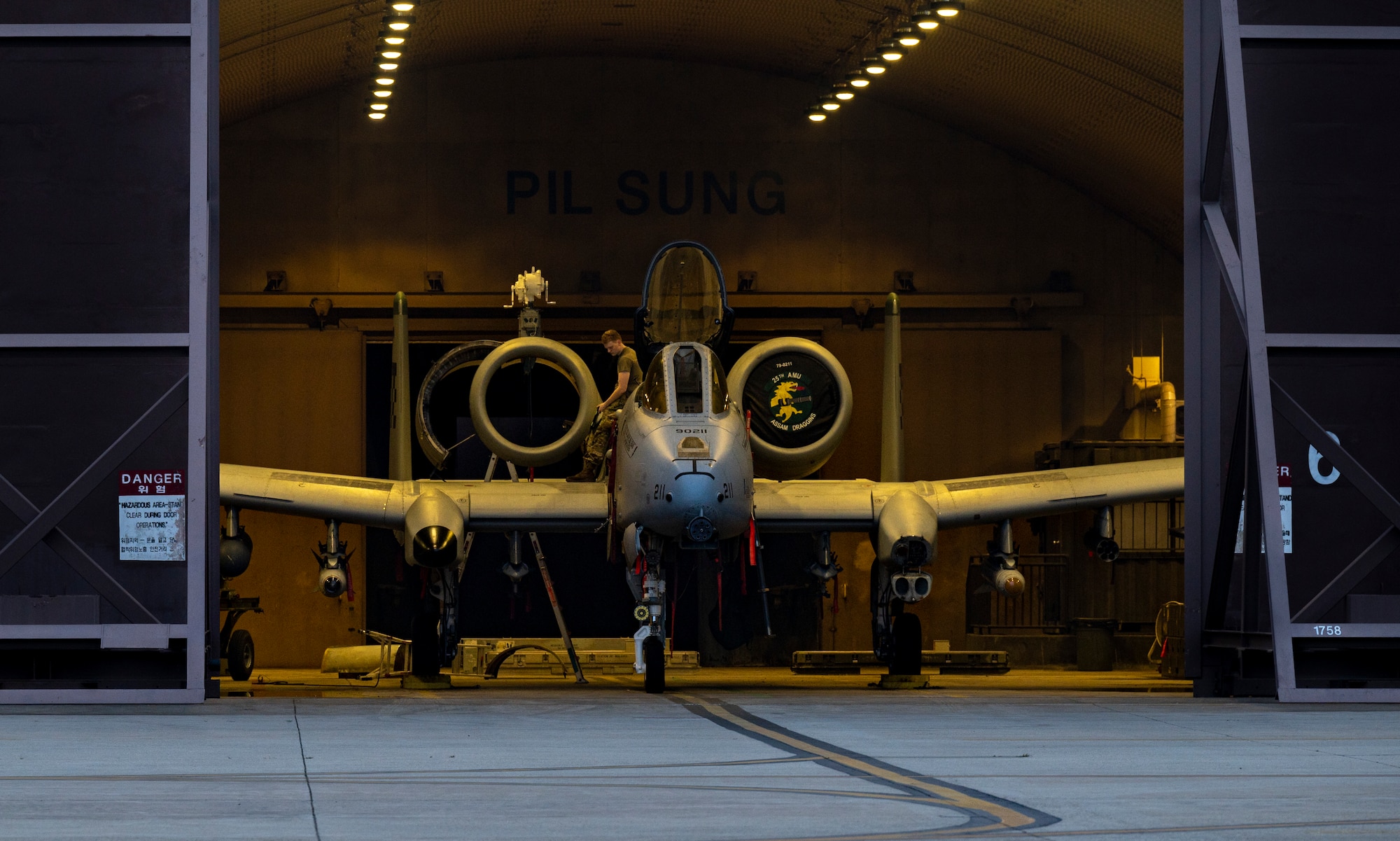 A 25th Fighter Generation Squadron crew chief, performs post flight maintenance on an A-10C Thunderbolt II at Osan Air Base, Republic of Korea, July 5, 2022.