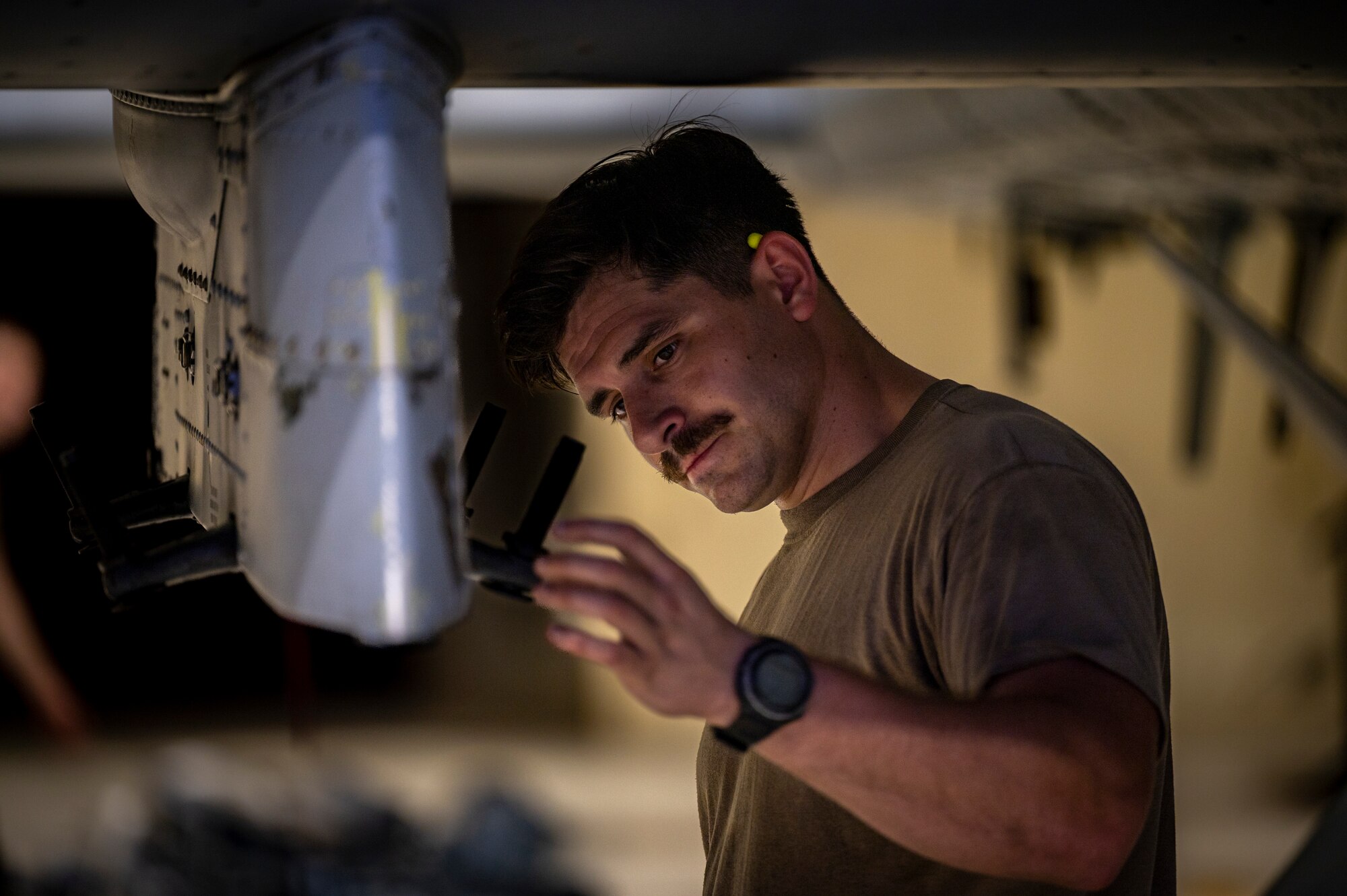 Staff Sgt. Jake Dromgold, 25th Fighter Generation Squadron crew chief, performs post flight maintenance on an A-10C Thunderbolt II at Osan Air Base, Republic of Korea, July 5, 2022.