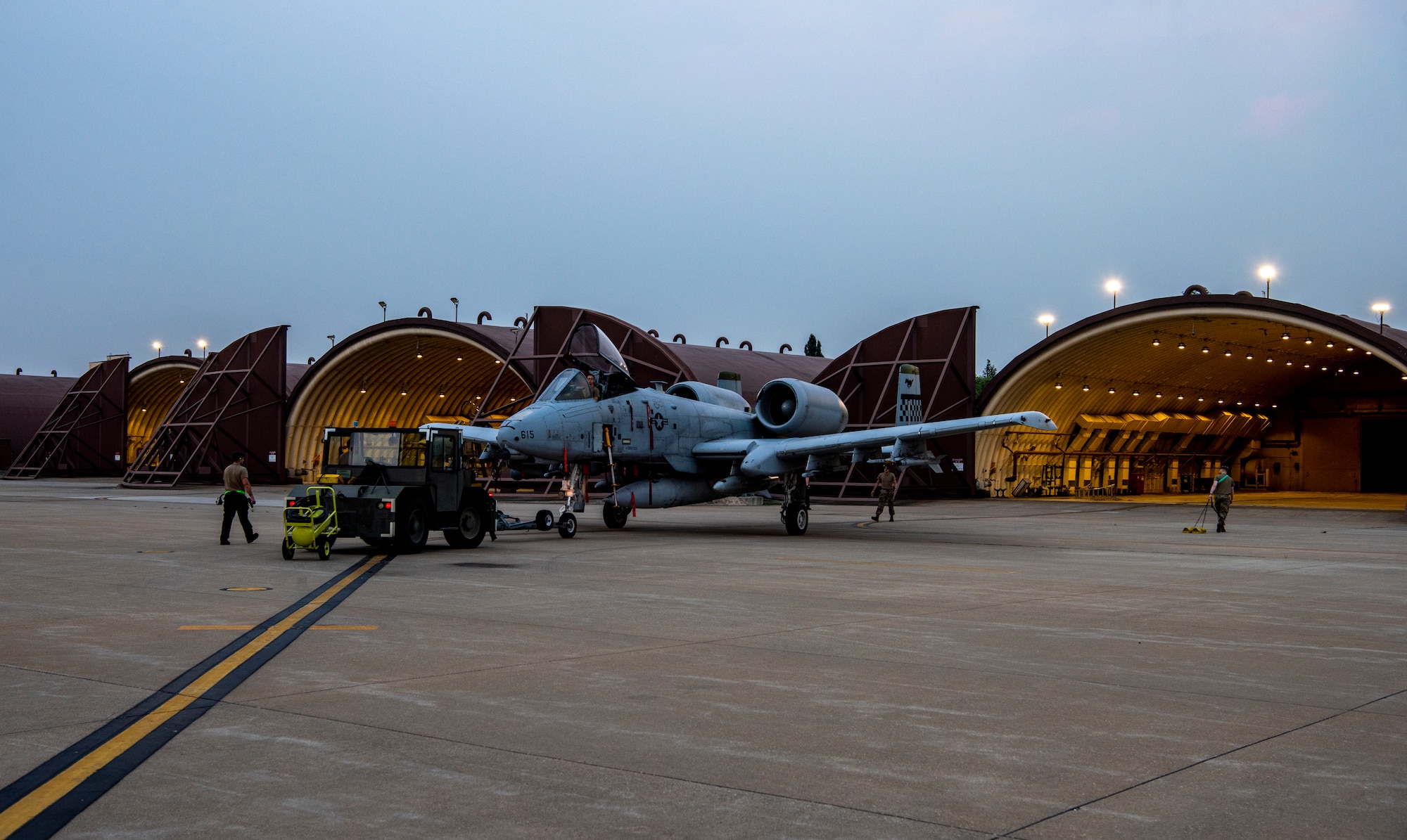 Airmen assigned to the 25th Fighter Generation Squadron transport an A-10C Thunderbolt II to a hangar at Osan Air Base, Republic of Korea, July 5, 2022.