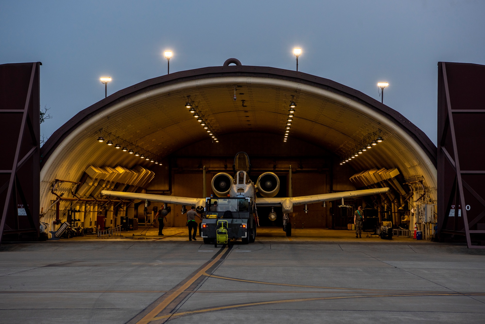 Airmen assigned to the 25th Fighter Generation Squadron transport an A-10C Thunderbolt II to a hangar at Osan Air Base, Republic of Korea, July 5, 2022.