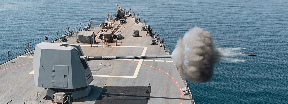 The guided-missile destroyer USS Momsen (DDG 92) participates in a live-fire gun exercise during Iron Defender 2022 in the Arabian Gulf.