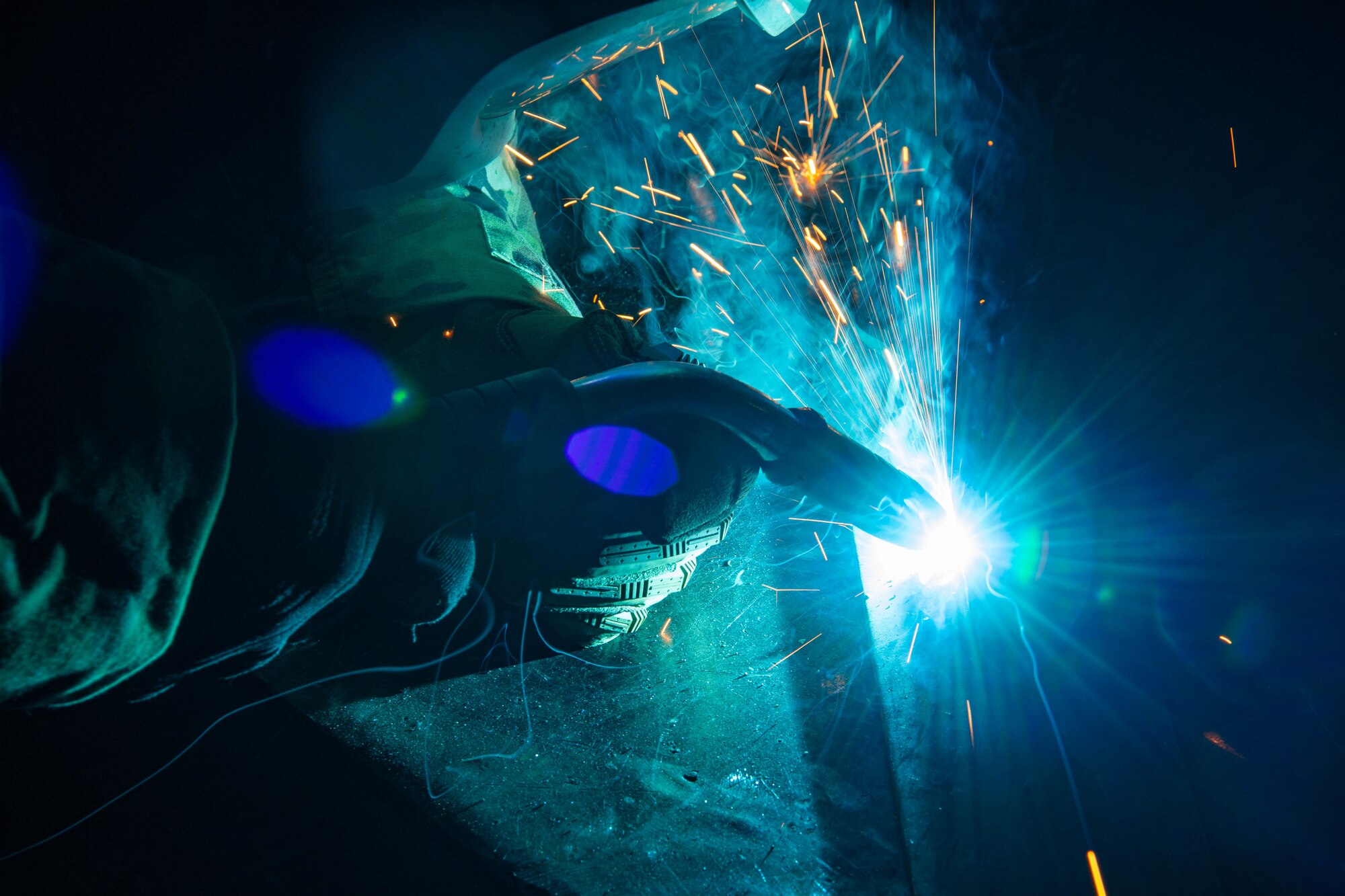 Staff Sgt. Branagan Glennen, 31st Maintenance Squadron metals technician craftsman, cuts a piece of metal using a mill  at Aviano Air Base, Italy, July 6, 2022. The mill is often used to fabricate aircraft parts and locally manufacture tools for different squadrons on Aviano. (U.S. Air Force photo by Senior Airman Noah Sudolcan)