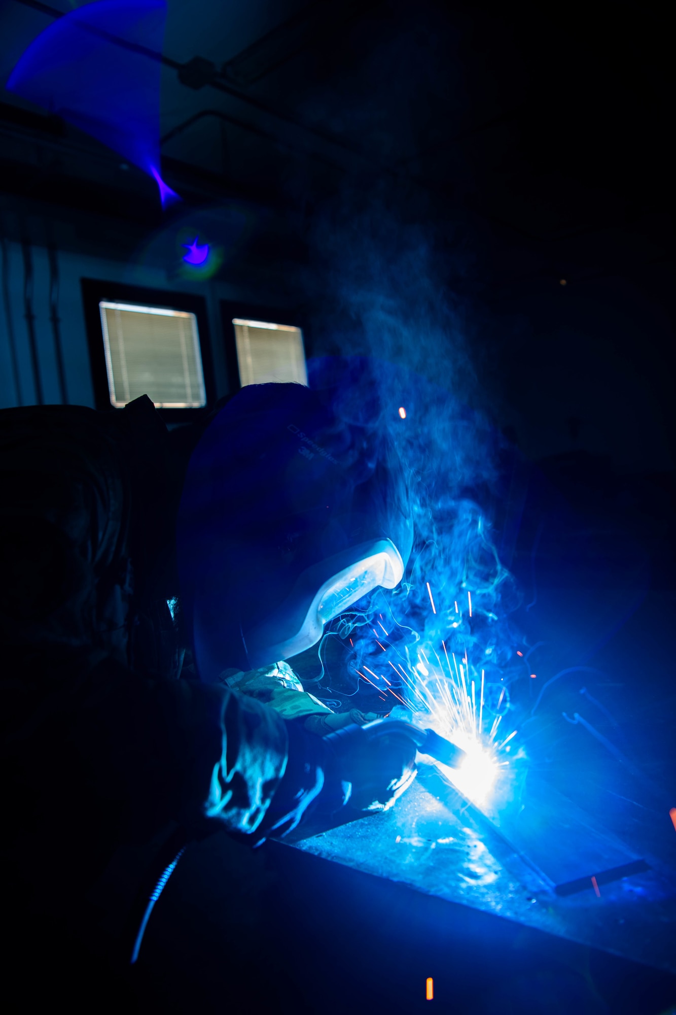 Staff Sgt. Branagan Glennen, 31st Maintenance Squadron metals technician craftsman, cuts a piece of metal using a mill  at Aviano Air Base, Italy, July 6, 2022. The mill is often used to fabricate aircraft parts and locally manufacture tools for different squadrons on Aviano. (U.S. Air Force photo by Senior Airman Noah Sudolcan)