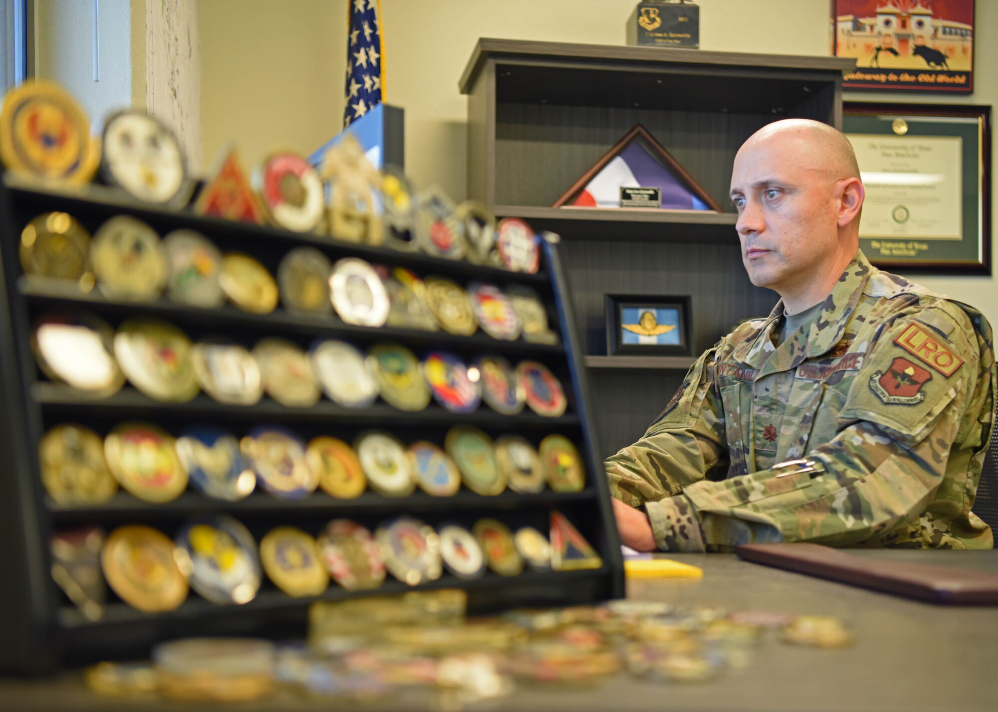 U.S. Air Force Maj. Jose Quintanilla, 17th Logistics Readiness Squadron commander, works in his office at Goodfellow Air Force Base, Texas, June 22, 2022. Quintanilla took command of the 17th LRS in May and expressed his intention to leverage his 25 years of experience to effectively lead members of his unit. (U.S. Air Force photo by Senior Airman Ethan Sherwood)