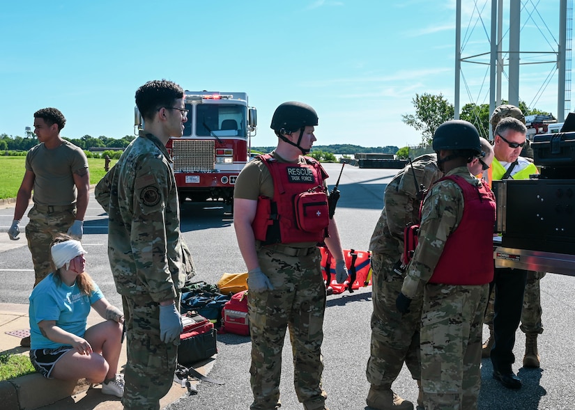 Members of the medical rescue task force discuss a plan of action during a base-wide active shooter exercise at Joint Base Langley-Eustis, Virginia, June 28, 2022.