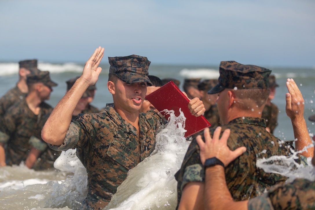 U.S. Marine Corps Cpl. Courtland Mabe, a Douglasville, Georgia, native and anti-tank missile gunner with 2d Light Armored Reconnaissance Battalion, 2d Marine Division, recites the Oath of Enlistment  on Camp Lejeune, North Carolina, July 6, 2022. Mabe was selected for reenlistment through the Commandant’s Retention Program which allows Marines that embody the whole Marine concept and represent the top echelon of Marines to bypass the twenty-step reenlistment process.