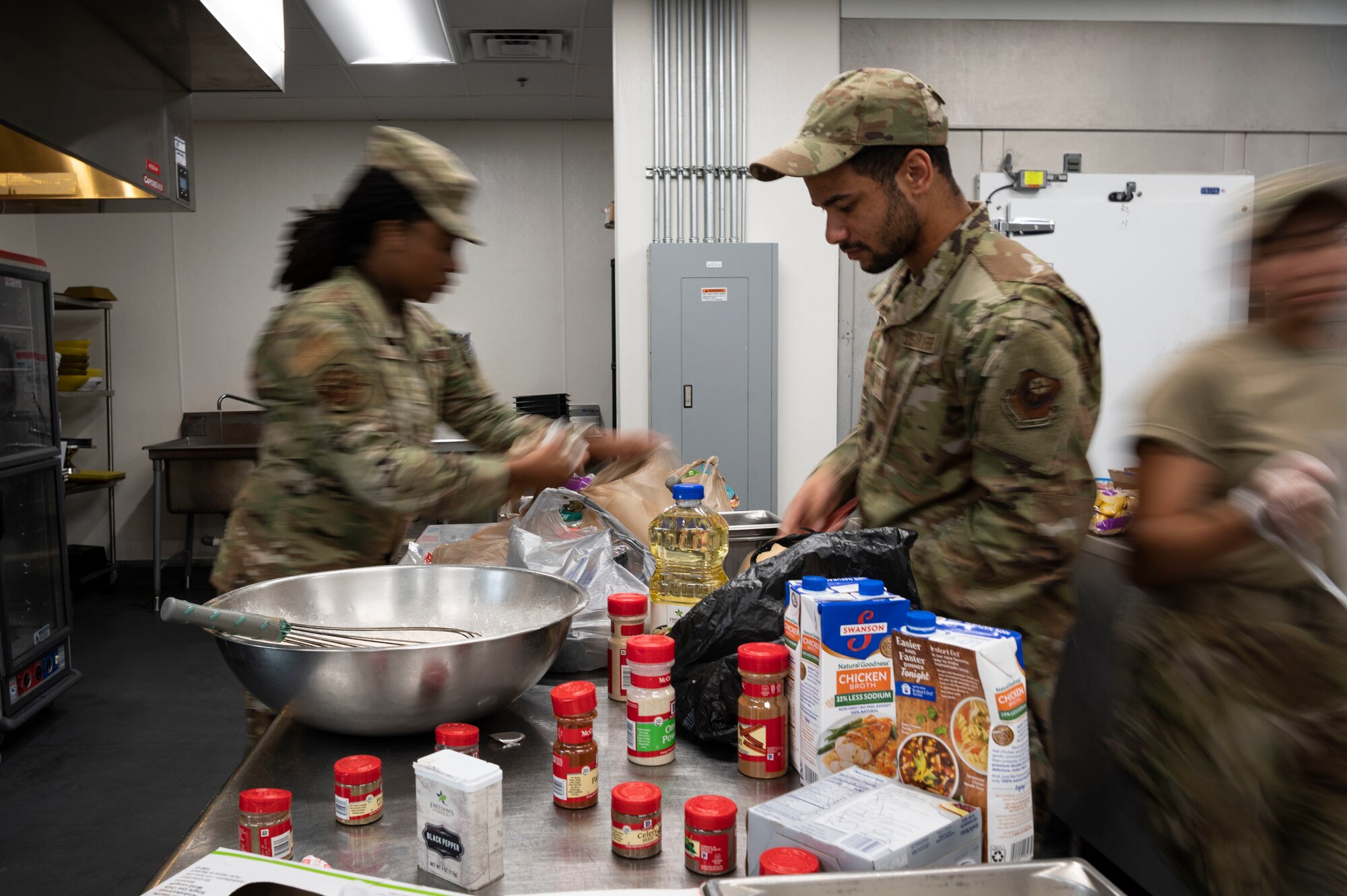 U.S. Air Force Chief Master Sgt. Marty Arnold, a 1st Special Operations Force Support Squadron culinary specialist, plates the meal her team has prepared during the 2022 Regional Chef Competition June 30, 2022, at Eglin Air Force Base, Florida.