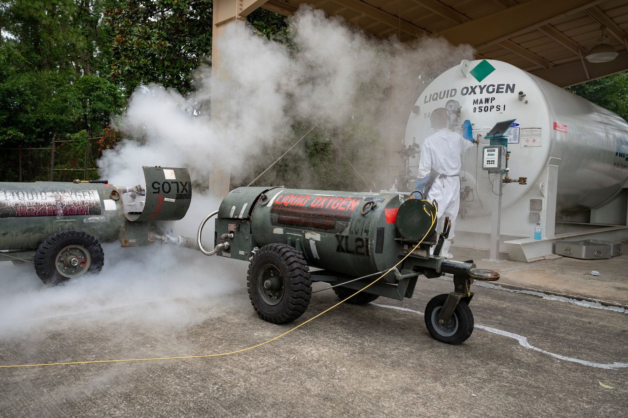 U.S. Air Force Senior Airman Robert Taylor, a 1st Special Operations Logistics Readiness Squadron fuels facilities technician, transports liquid oxygen from a 3,000-gallon storage tank to a 50-gallon mobile LOX cart June 15, 2022, at Hurlburt Field, Florida.