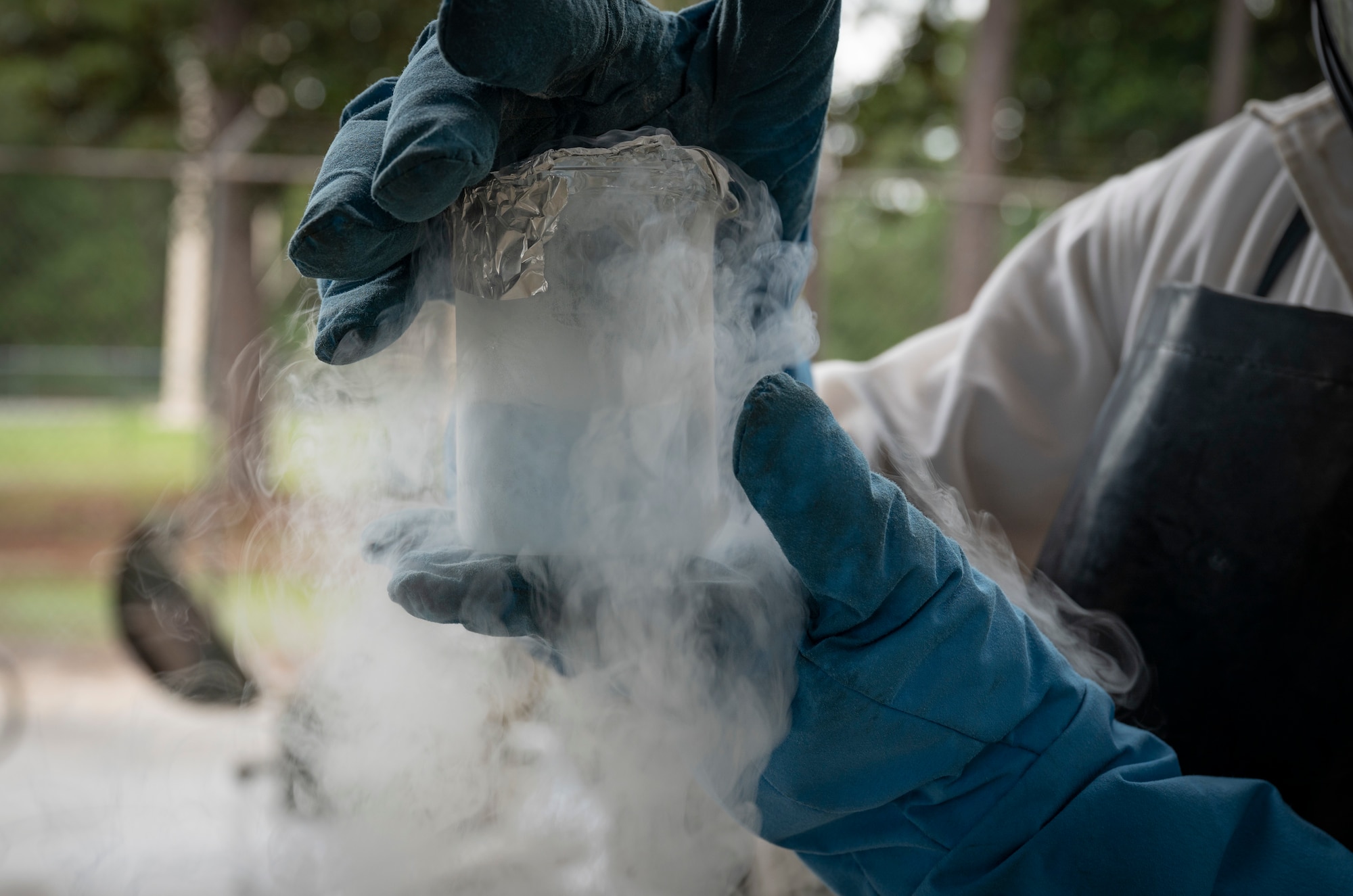 U.S. Air Force Senior Airman Robert Taylor, a 1st Special Operations Logistics Readiness Squadron fuels facilities technician, holds a liquid oxygen sample June 15, 2022, at Hurlburt Field, Florida.