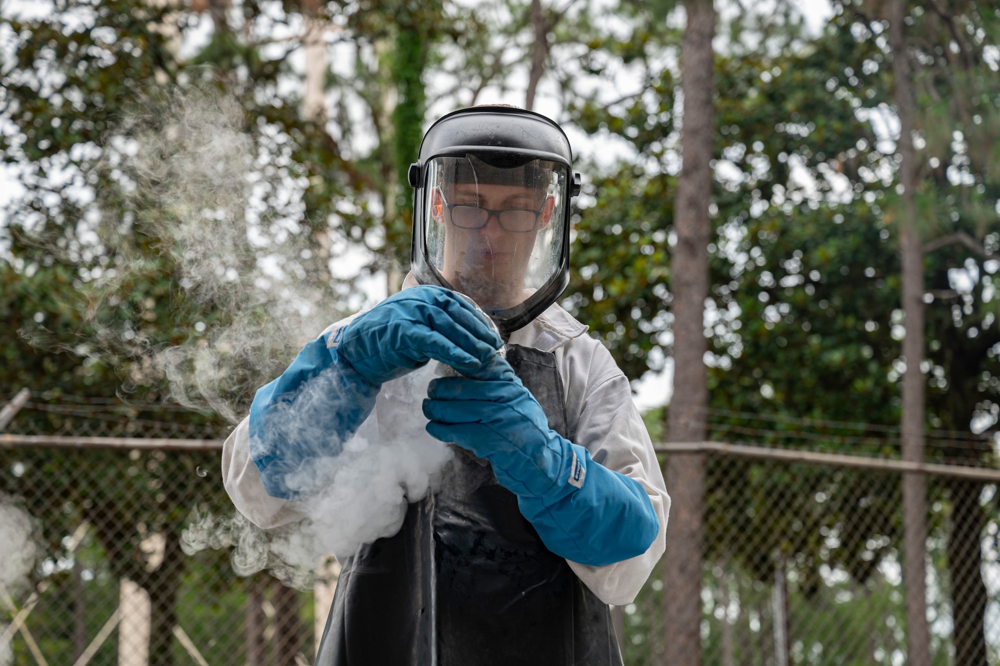 U.S. Air Force Senior Airman Robert Taylor, a 1st Special Operations Logistics Readiness Squadron fuels facilities technician, takes a sample of liquid oxygen to conduct an odor test June 15, 2022, at Hurlburt Field, Florida.
