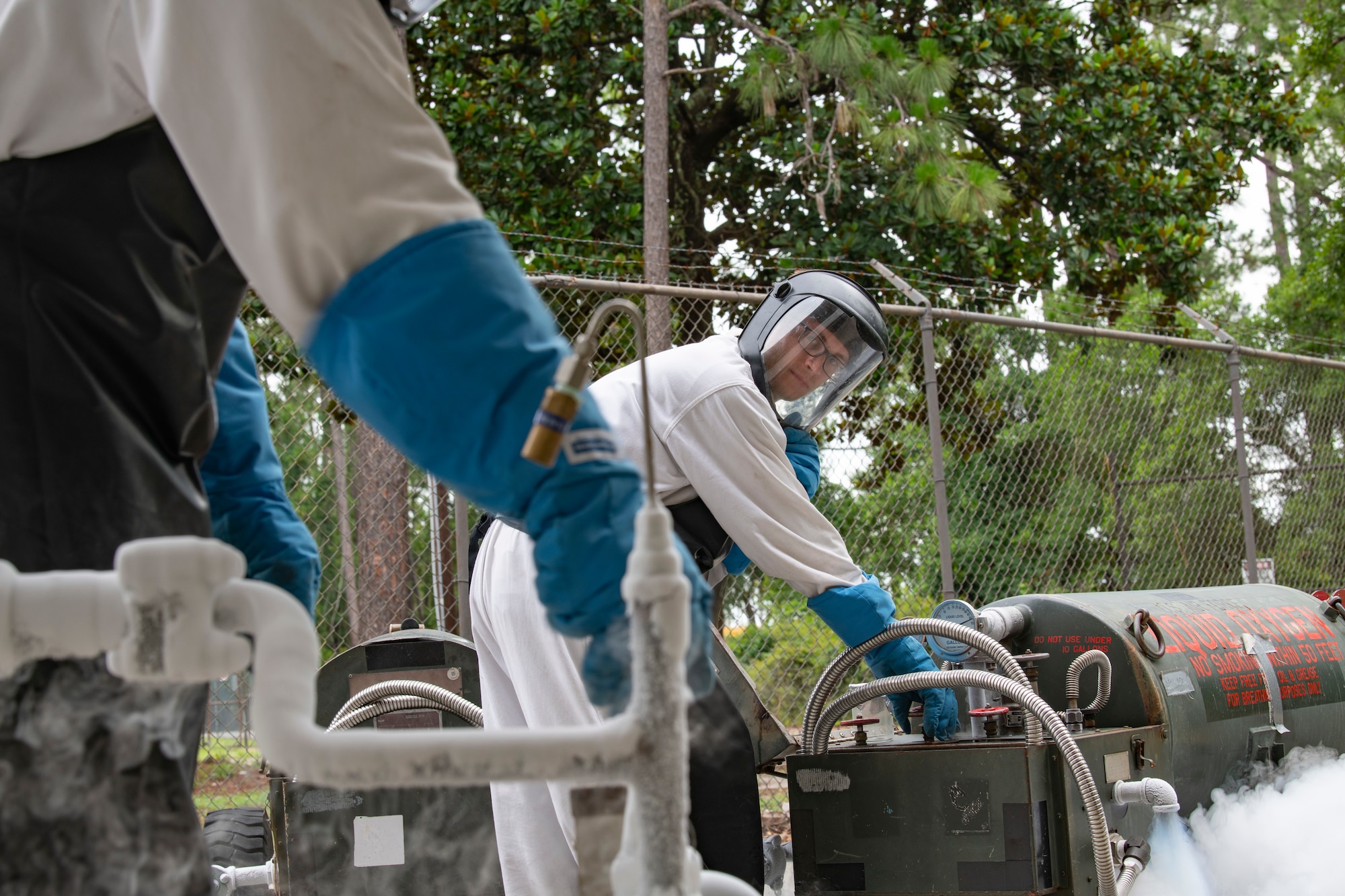 U.S. Air Force Senior Airman Robert Taylor, a 1st Special Operations Logistics Readiness Squadron fuels facilities technician, closes a valve on a cart that has been filled with liquid oxygen June 15, 2022, at Hurlburt Field, Florida.