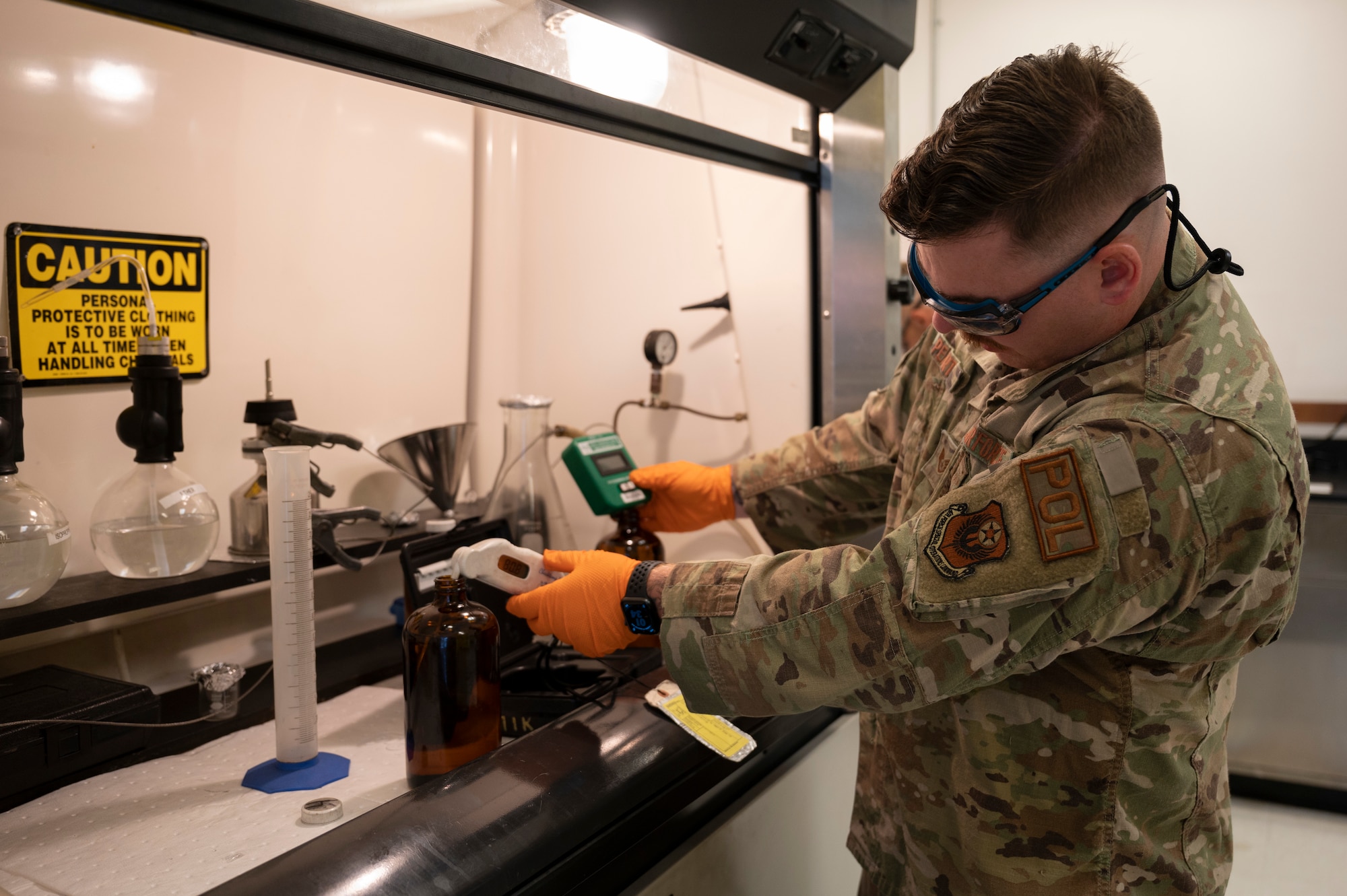 U.S. Air Force Staff Sgt. Alexander Peart, a 1 Special Operations Logistics Readiness Squadron fuels laboratory technician noncommissioned officer in charge, tests the temperature and conductivity of a fuel sample June 15, 2022, at Hurlburt Field, Florida.