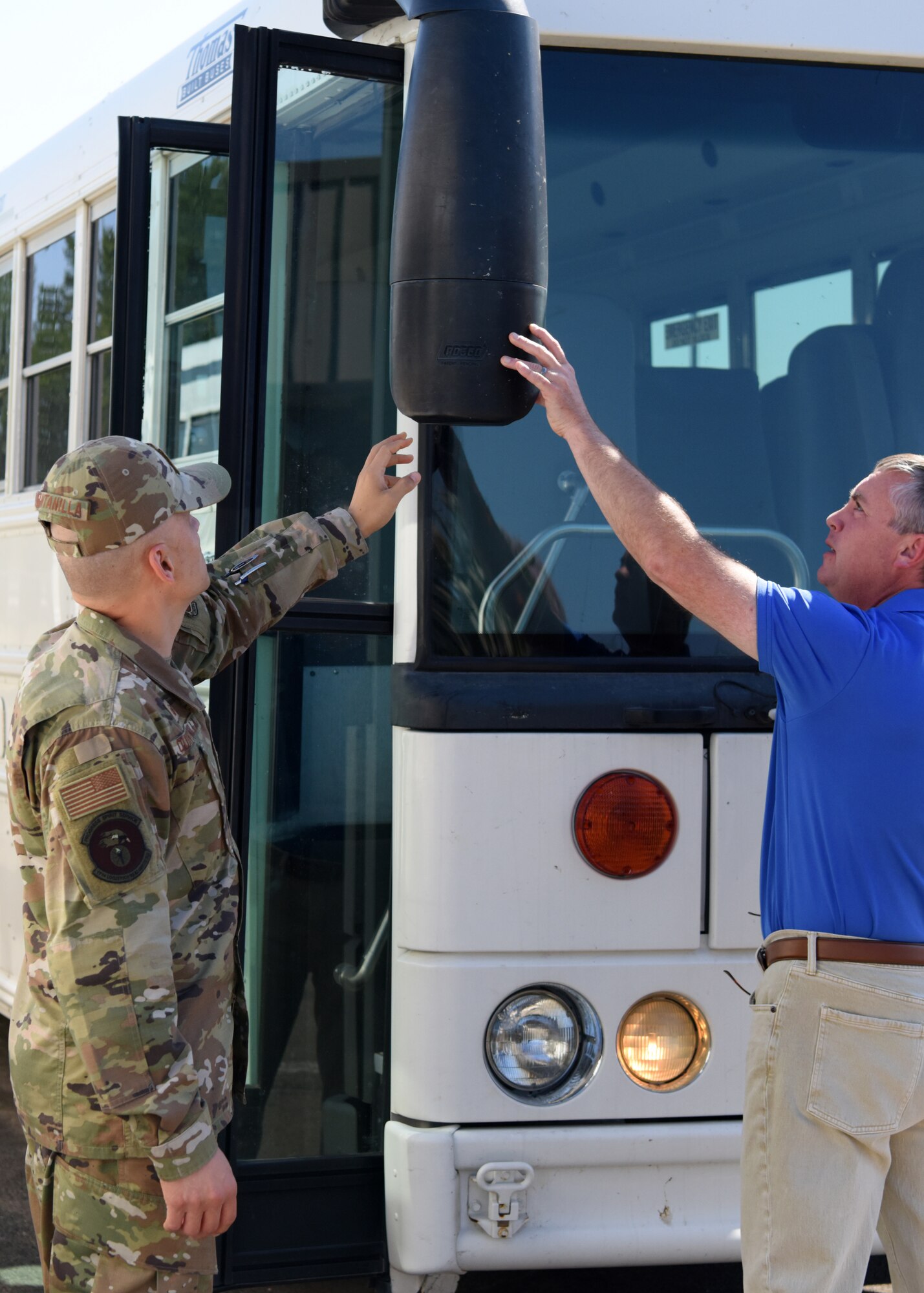 U.S. Air Force Maj. Jose Quintanilla, 17th Logistics Readiness Squadron commander, inspects a bus at Goodfellow Air Force Base, Texas, June 22, 2022. Quintanilla and his team are responsible for all vehicle maintenance on Goodfellow. (U.S. Air Force photo by Senior Airman Ethan Sherwood)