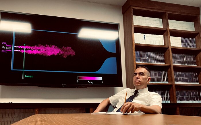 Photo of 2nd Lt. Javier Urzay sititng at a conference table.
