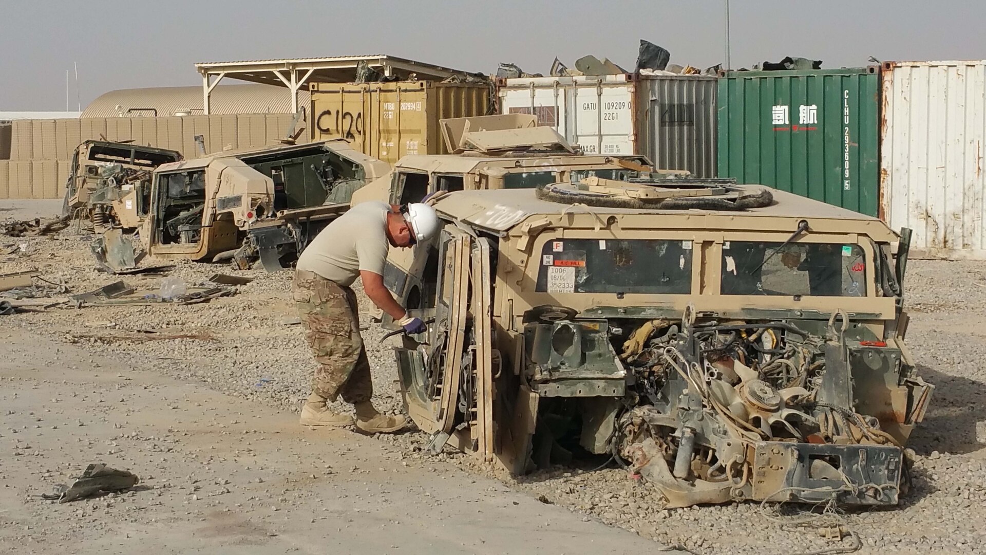 A Humvee and servicemember in Afghanistan