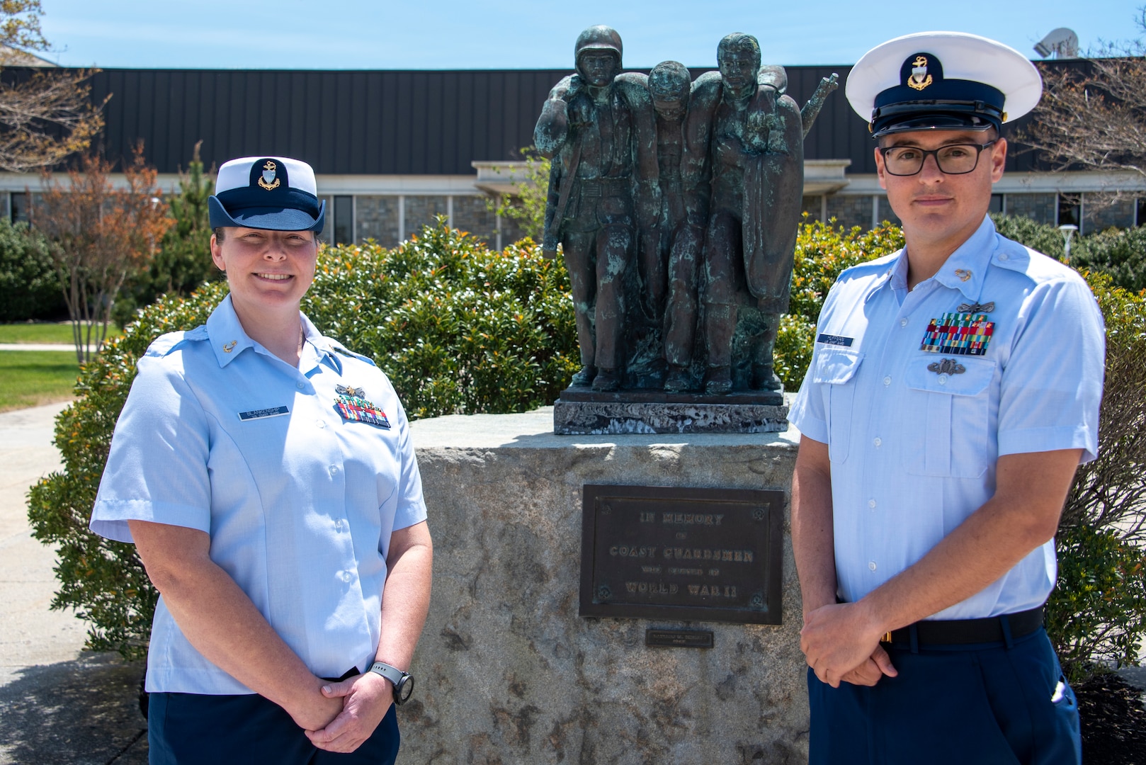 Chief Petty Officer Kailea Blankenship, a boatswain’s mate with USCG Station Galveston, the Coast Guard 2021 Enlisted Person of the Year - Active Duty Component; and Chief Petty Officer Ryan Huffman, a machinery technician with USCG Staton Channel Islands, the Coast Guard 2021 Enlisted Person of the Year - Reserve Component, pose for a photo after being recognized by Master Chief Petty Officer Jason Vanderhaden and Master Chief Petty Officer of the Coast Guard Reserve George Williamson at Coast Guard Training Center Cape May, New Jersey, May 18, 2022. (U.S. Coast Guard photo by Petty Officer 1st Class Lisa Ferdinando)