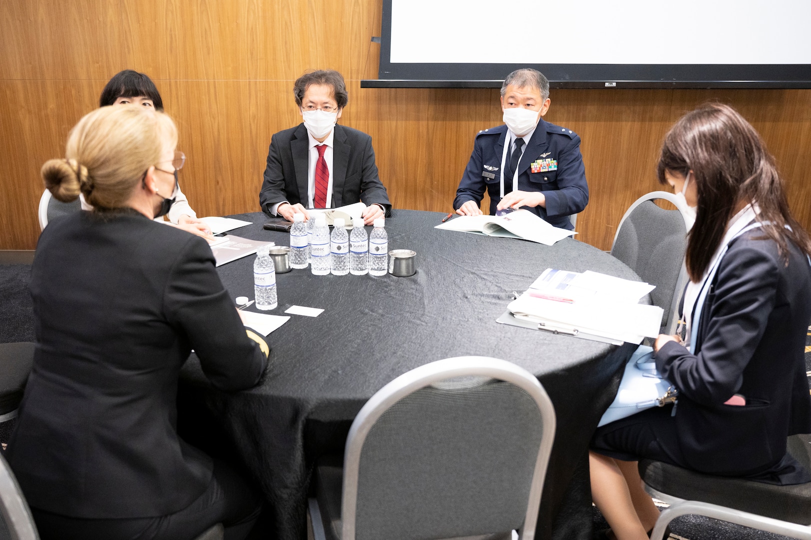 Rear Adm. Pamela Miller (front-left), Command Surgeon for U.S. Indo-Pacific Command, speaks with delegates from Japan during the second Military-Civilian Health Security Summit June 27, 2022, in Singapore. The summit, held June 27-28, focused on regional approaches to global health security through interagency cooperation with allies and partners.