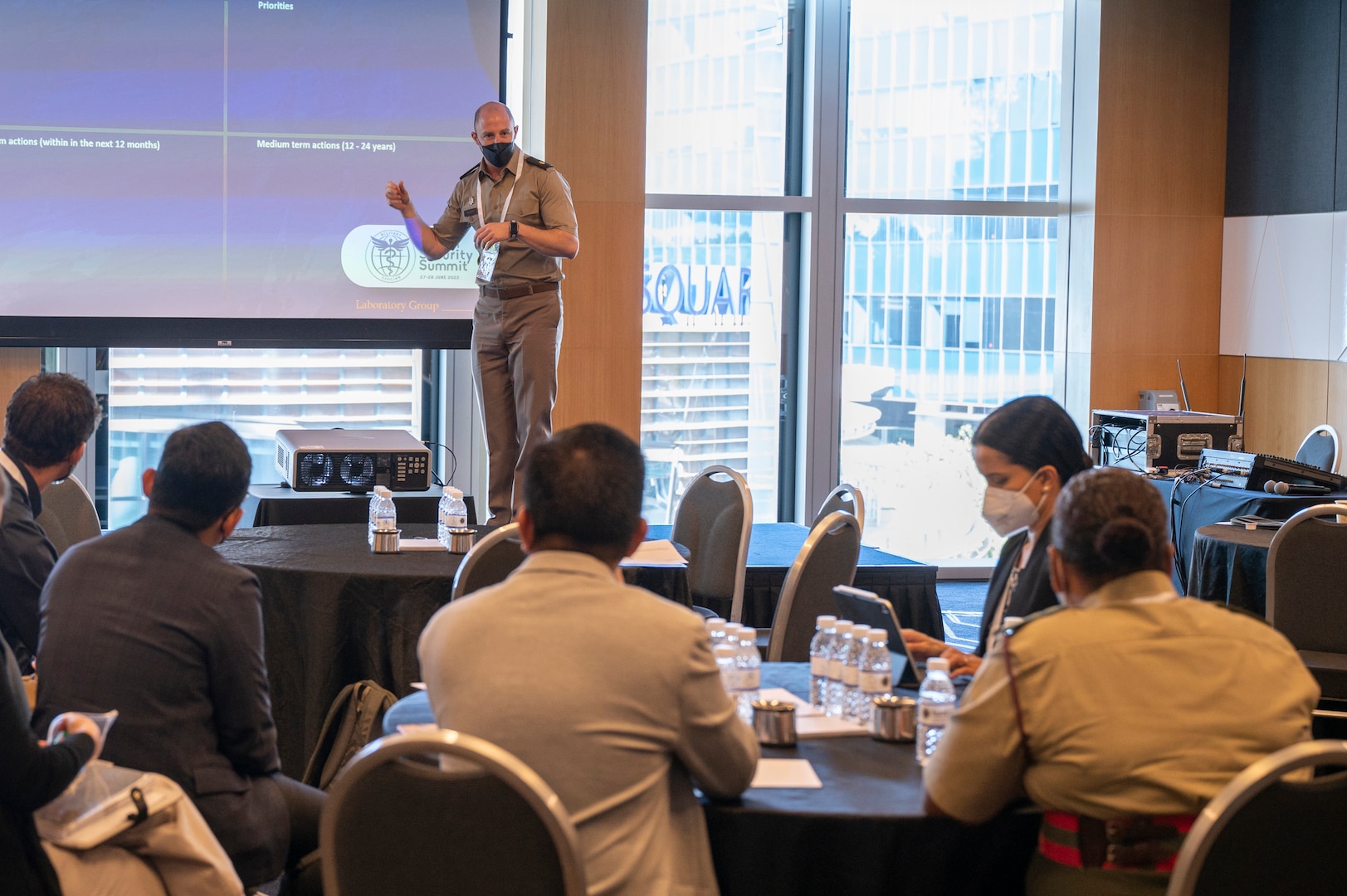 Delegates from multiple nations discuss analysis tactics during the second Military-Civilian Health Security Summit June 28, 2022, in Singapore. The summit, held June 27-28, focused on regional approaches to global health security through interagency cooperation with allies and partners.