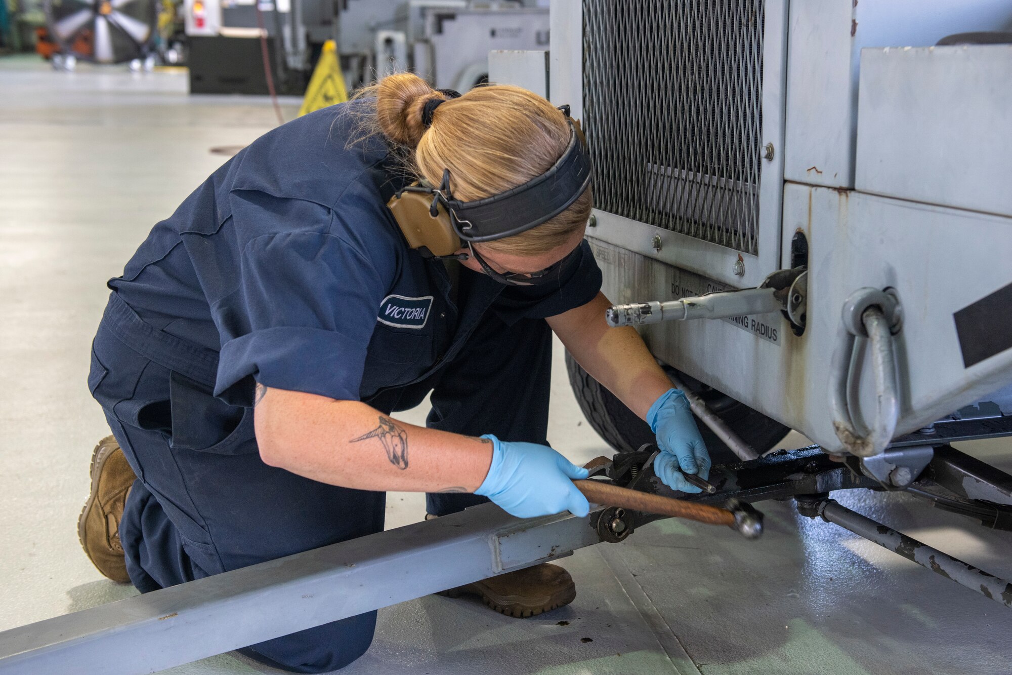 U.S. Air Force Tech. Sgt. Victoria Fiola, 512th Maintenance Squadron aerospace ground equipment technician, repairs the tow bar on a B809 generator at Dover Air Force Base, Delaware, July 6, 2022. Checking the security of a tow bar is part of a major annual inspection on the generator. In keeping with their squadron’s motto, “Strength in Reserve,” Airmen at the 512th MXS routinely maintain ground equipment to be ready for use with any mission. (U.S. Air Force photo by Senior Airman Ruben Rios)
