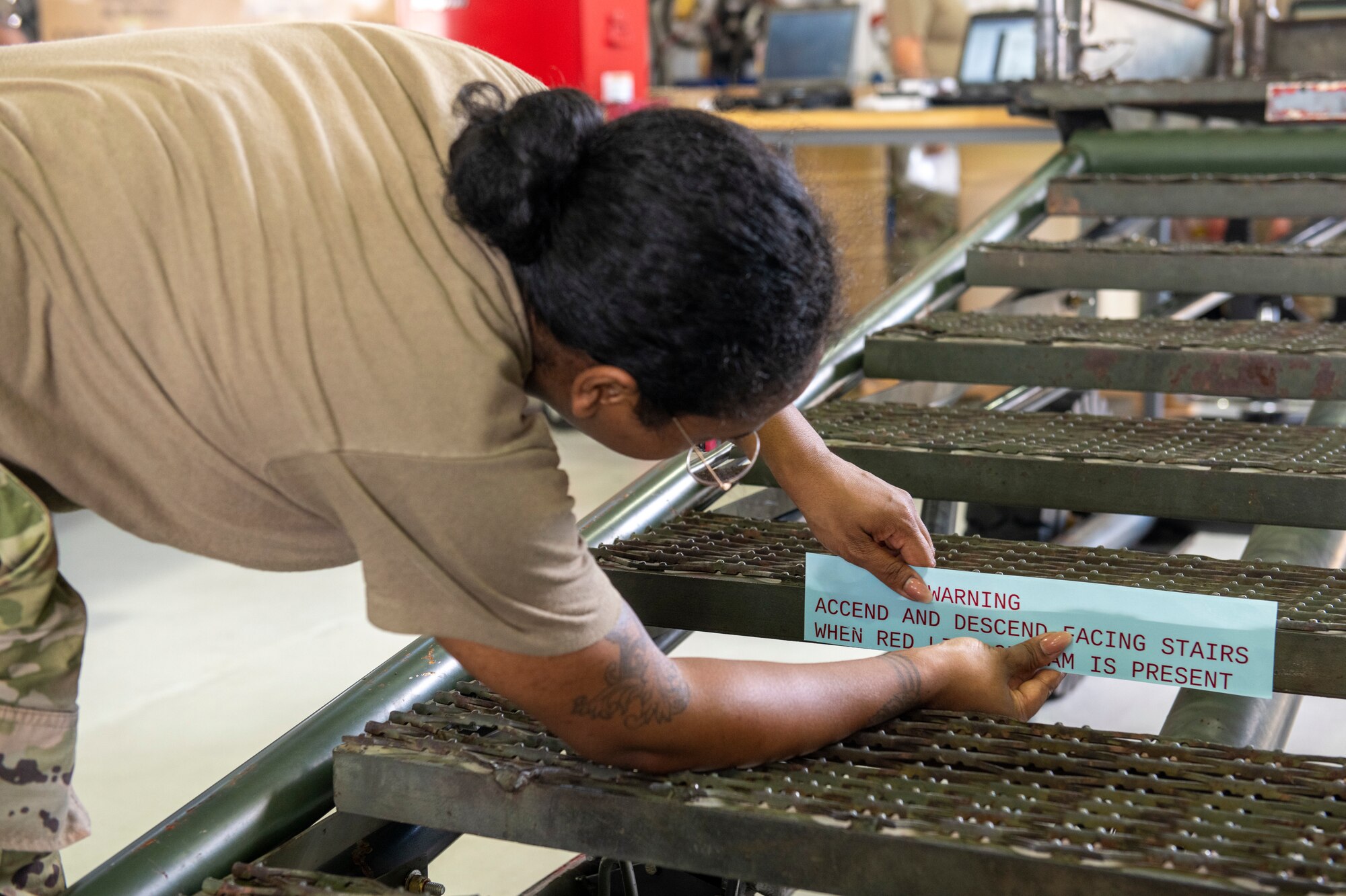 U.S. Air Force Senior Airman Naris Muenrit, 512th Maintenance Squadron aerospace ground equipment technician, measures a stencil on a B1 aircraft maintenance stand at Dover Air Force Base, Delaware, July 6, 2022. Over time, stencils fade and new ones must be re-adhered to provide warnings or directions for use of equipment. In keeping with their squadron’s motto, “Strength in Reserve,” Airmen at the 512th MXS routinely maintain ground equipment to be ready for use with any mission. (U.S. Air Force photo by Senior Airman Ruben Rios)