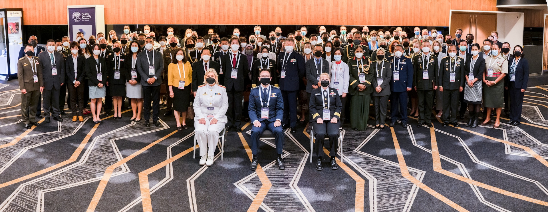 Rear Adm. Sarah Sharkey, the Australian Defense Force (ADF) Joint Health Surgeon, Col. Benjamin Tan, the Singapore Armed Forces Deputy Surgeon General, and Rear Adm. Pamela Miller, Command Surgeon for U.S. Indo-Pacific Command, pose for a photo with delegates from 25 nations during the second Military-Civilian Health Security Summit June 27, 2022, in Singapore. The summit, held June 27-28, focused on regional approaches to global health security through interagency cooperation with allies and partners.