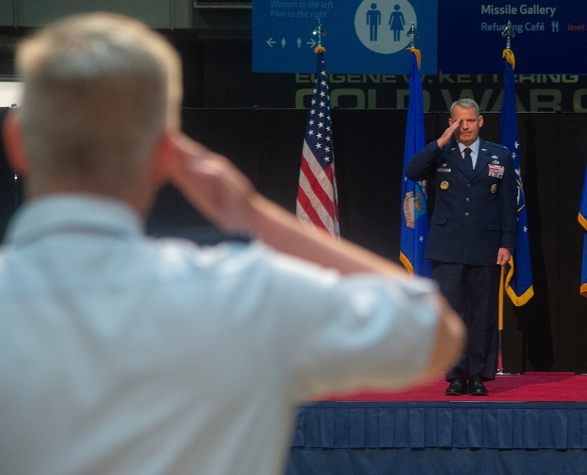 Col. Christopher Meeker returns his first salute as 88th Air Base Wing and installation commander during a change of command ceremony July 7, 2022, inside the National Museum of the U.S. Air Force at Wright-Patterson Air Force Base, Ohio. Meeker assumed command from Col. Patrick Miller, who had served in the position for two years.