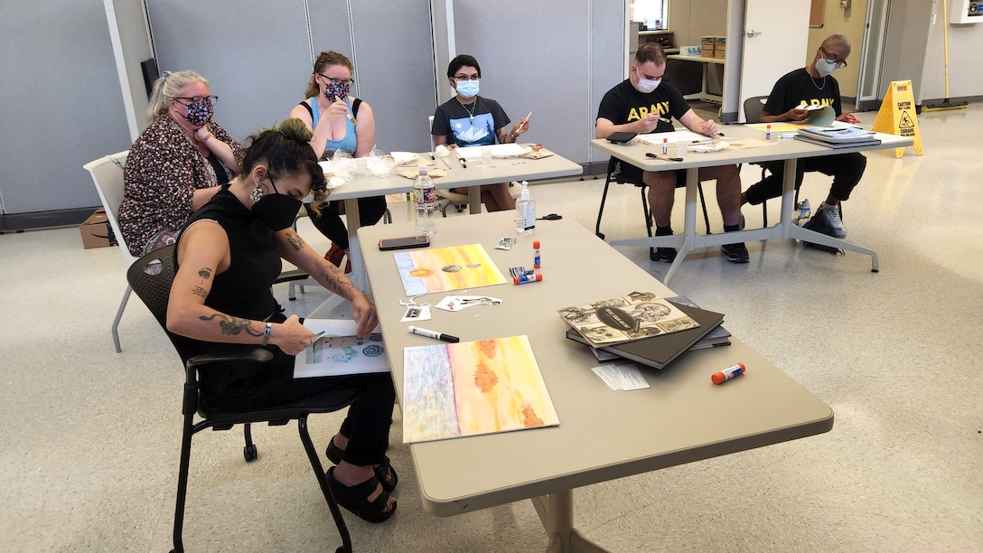Recovering service members learn painting skills during an art clinic.