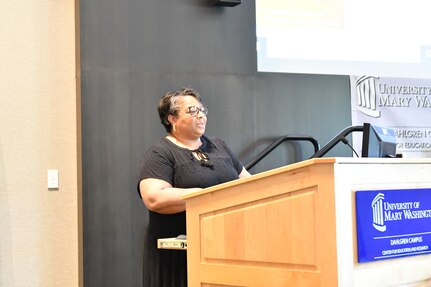 IMAGE: Dr. Sherry Springs of the Naval Surface Warfare Center Dahlgren Division (NSWCDD) African American/Black Employment Special Emphasis Program introduces the panelists at NSWCDD’s commemoration of Juneteenth 2022 at the University of Mary Washington Dahlgren Campus, June 30.