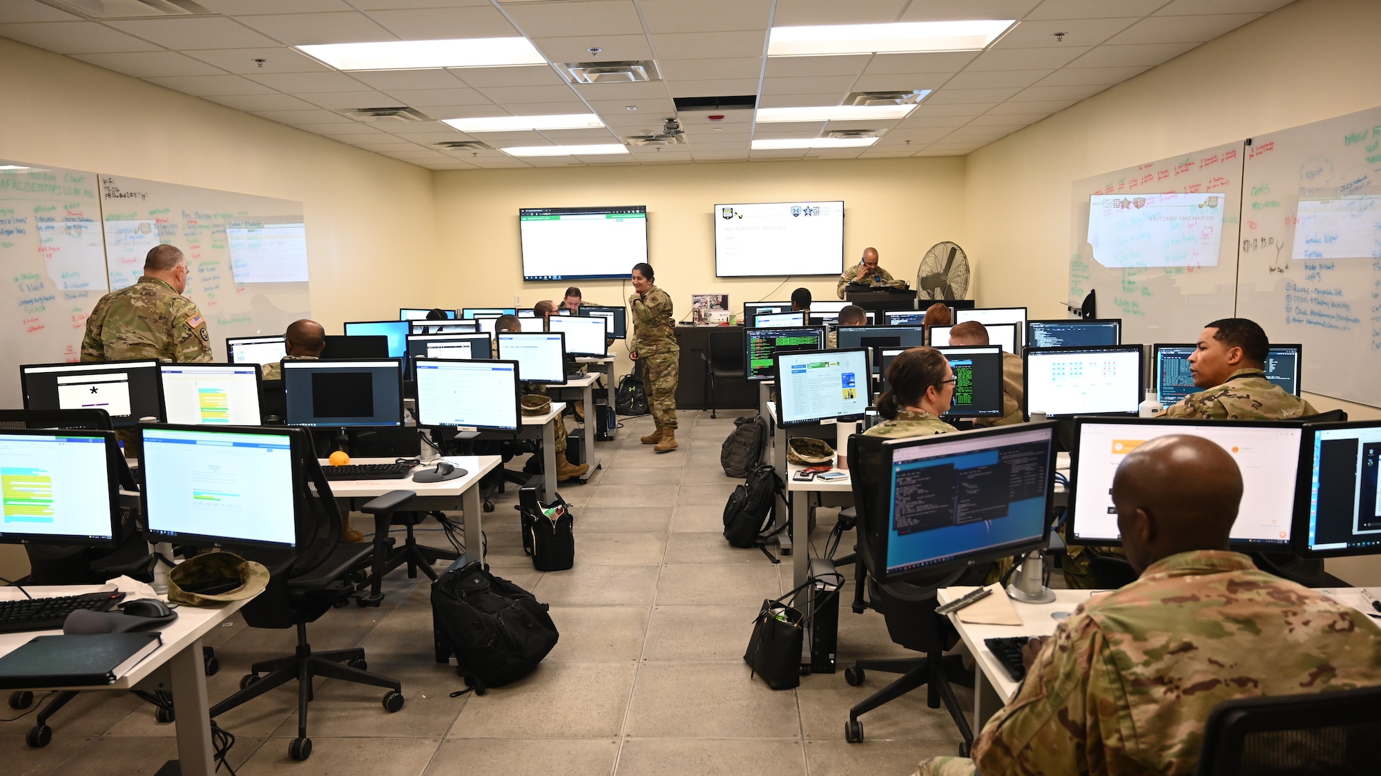 Members of the 175th Cyberspace Operations Group and the 169th Cyber Protection Team, Maryland Air National Guard prepare their workstations before the start of Cyber Blitz 22-3 at Warfield Air National Guard Base, Middle River, Maryland on March 23, 2022.