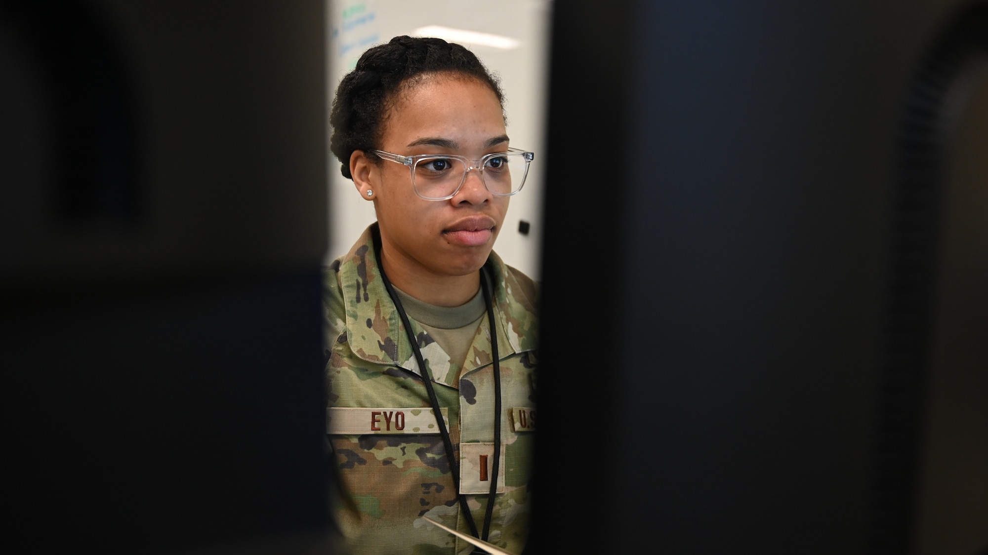 U.S. Air Force 1st Lt. Alexis Eyo, 275th Cyberspace Operations Squadron cyber officer, Maryland Air National Guard works at a computer during Cyber Blitz 22-3 at Warfield Air National Guard Base, Middle River, Maryland on March 23, 2022.