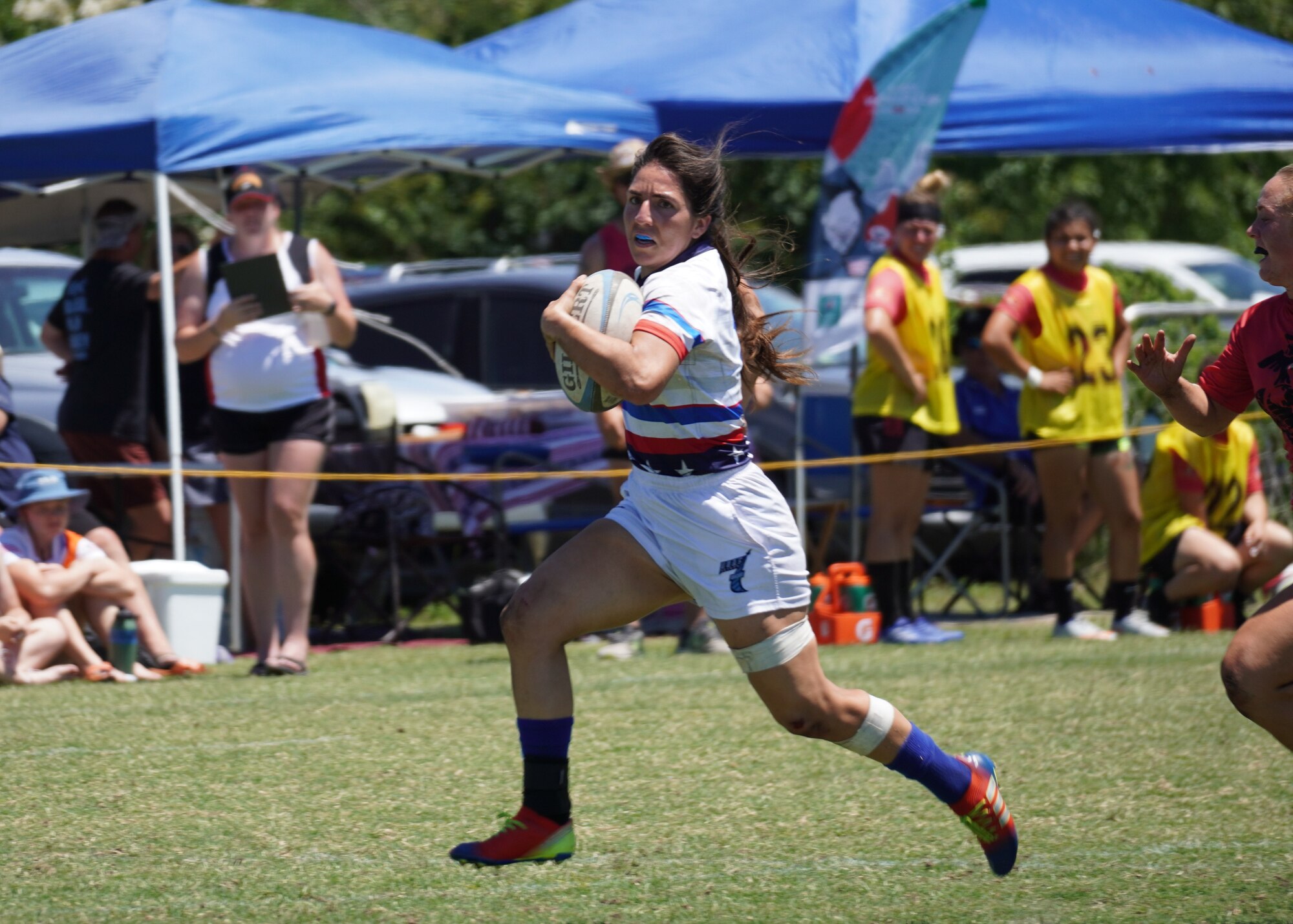 A photo of people playing rugby.