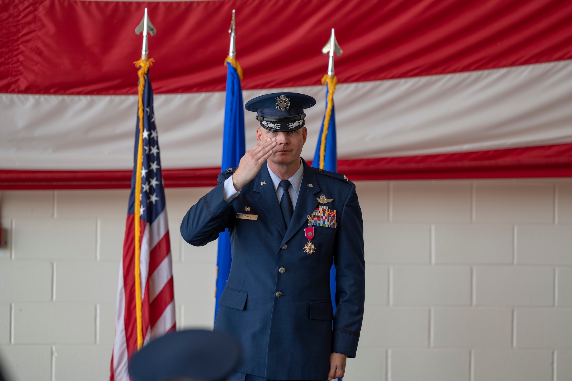 Col. James Young, outbound 317th Airlift Wing commander, renders his final salute to 317th AW Airmen at Dyess Air Force Base, Texas, July 7, 2022. During Col Young’s time as the 317th AW commander, the wing conducted eight Agile Combat Employment exercises. Agile Combat Employment is a proactive and reactive operational scheme of maneuver executed within threat timelines to increase resiliency and survivability while generating combat power throughout the integrated deterrence continuum. (U.S. Air Force photo by Senior Airman Josiah Brown)