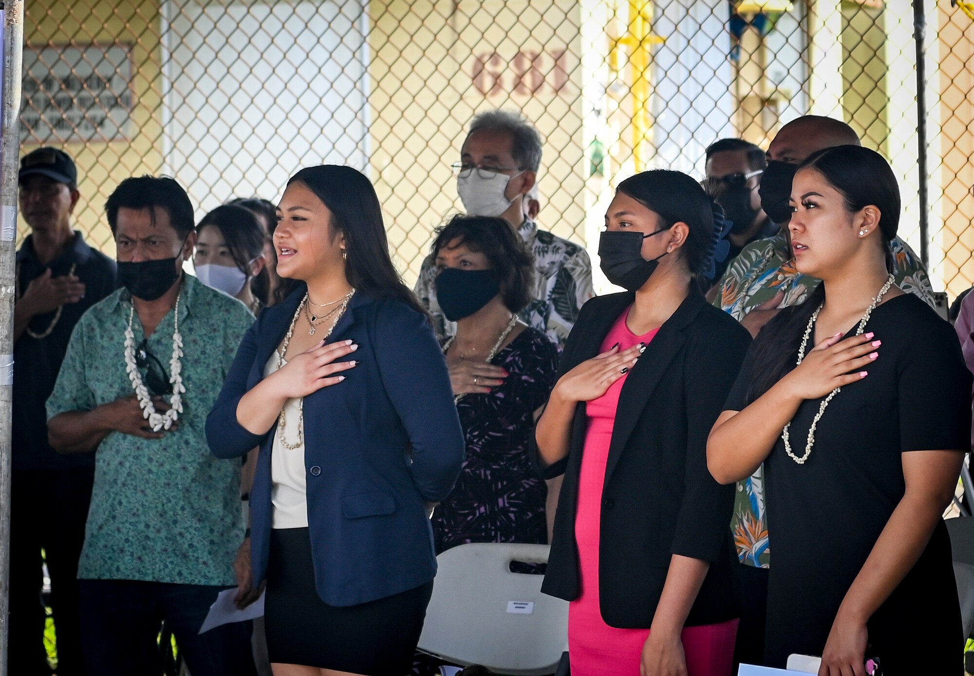 Local Chamoru families sing the Guam Hymn during the Hasso Monmong-Toto-Maite Marine Depot Memorial Ceremony in Maite, Guam on July 7, 2022.